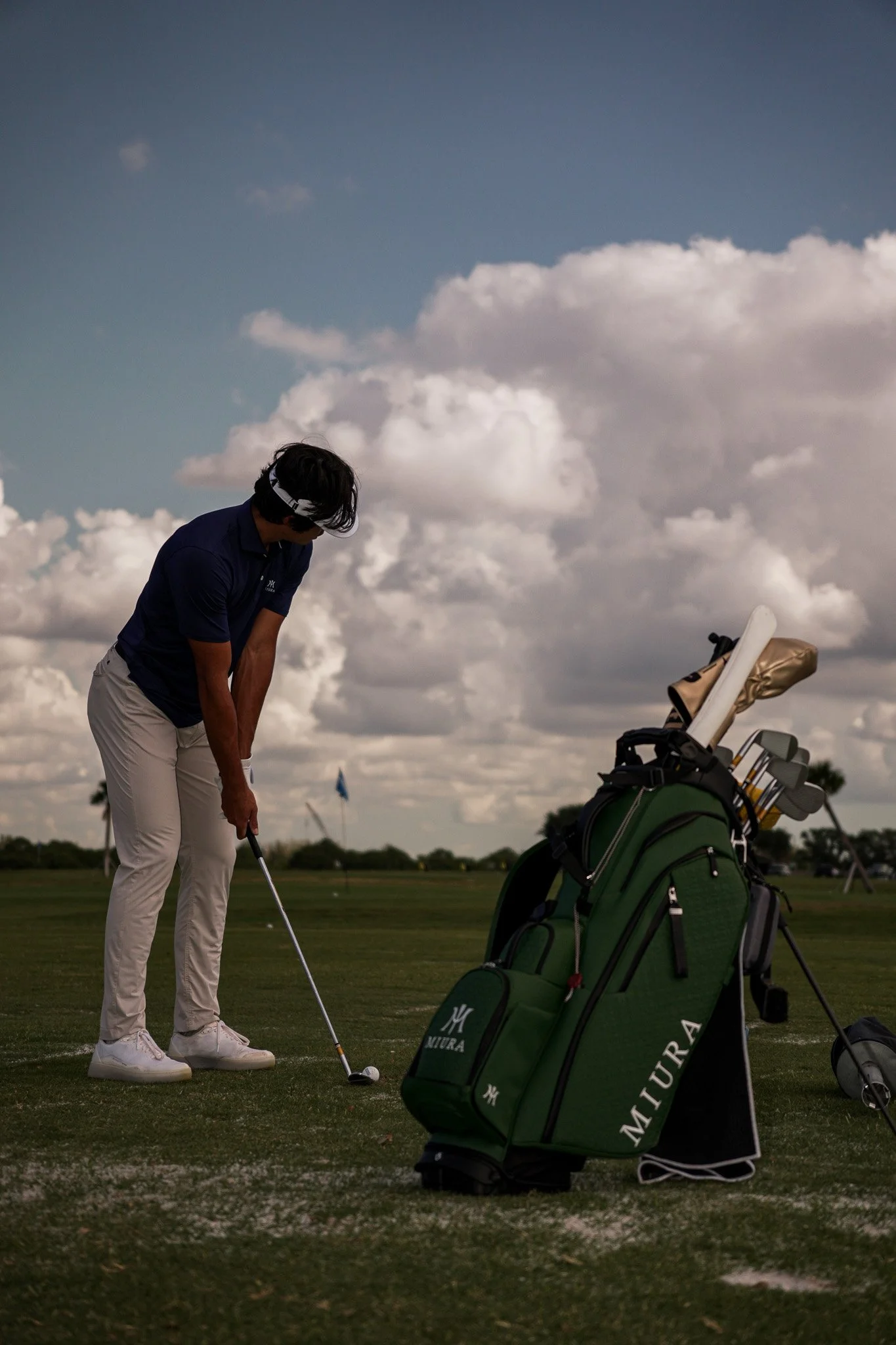 Professional golfer Leo Herrera III hitting a golf shot during a commercial brand campaign captured by Threadline Collective, showcasing talent, creative production, and sports marketing.