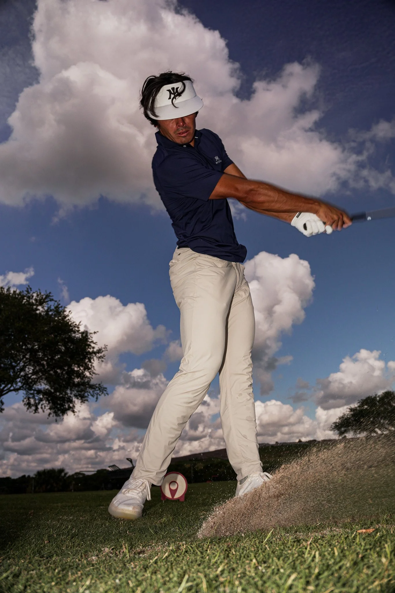 Professional golfer Leo Herrera III hitting a golf shot during a commercial brand campaign captured by Threadline Collective, showcasing talent, creative production, and sports marketing.