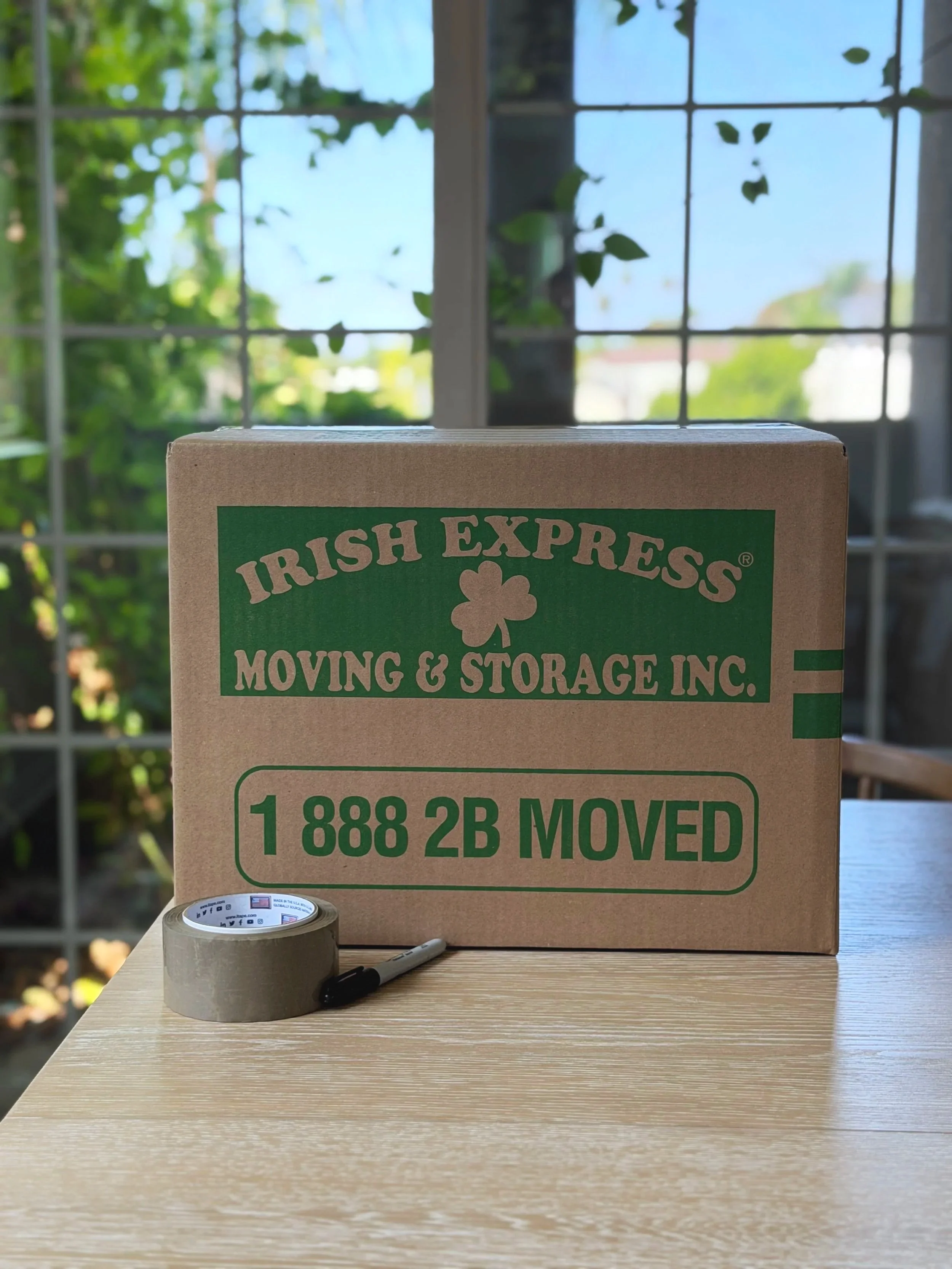 Irish Express box on table next to packing tape and sharpie