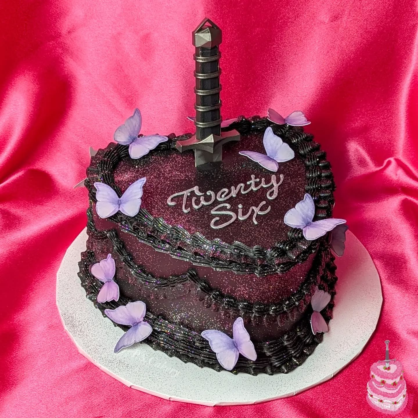 This was a favorite cake from a while ago!!! It just got buried in my photos but she's here now 💜 I only used silver glitter but she's so sparkly she's picking up so much of the pink background in the photos, still love her though 🪩🦋🗡️

Hope ever