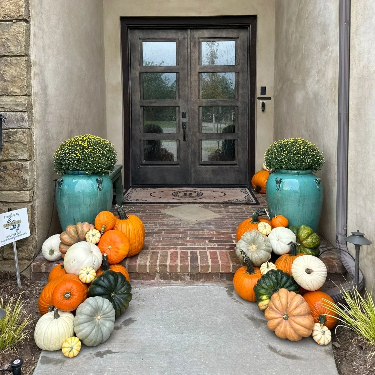 A charming setup that brings seasonal warmth to smaller porches