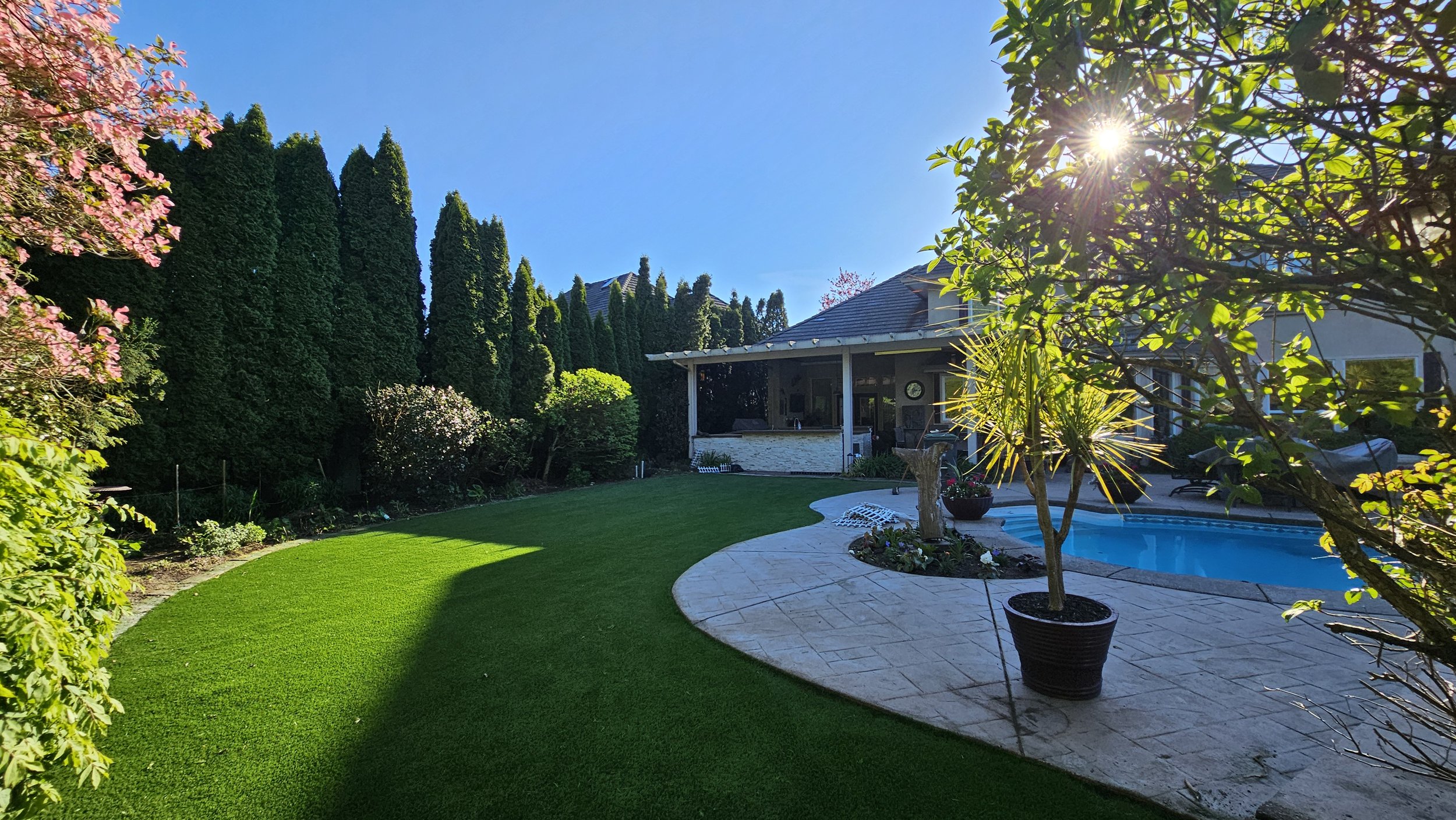 artificial grass installation in backyard