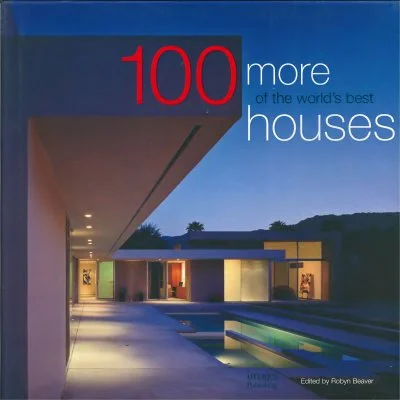 Cover of a book titled '100 More Houses' showing a modern house with large windows and a pool at dusk.