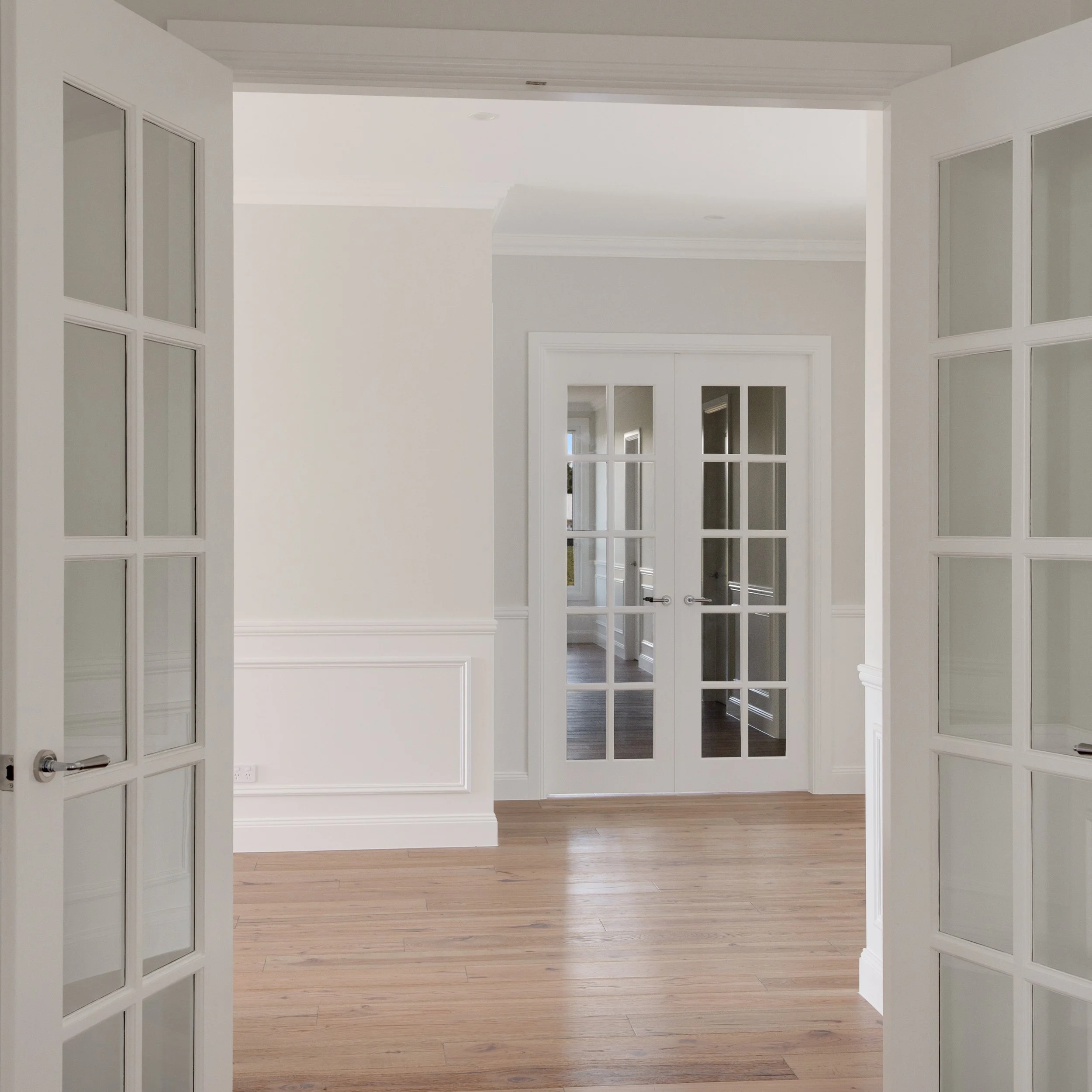 Room to room, the details carry through. Showcasing our latest build in the Southern Highlands.

Built by @cetaprojects 
Photography by @bodhiandco.media 

#frenchdoors #timberfloors #wallpanelling #interiordetails #classicinteriors
#southernhighland