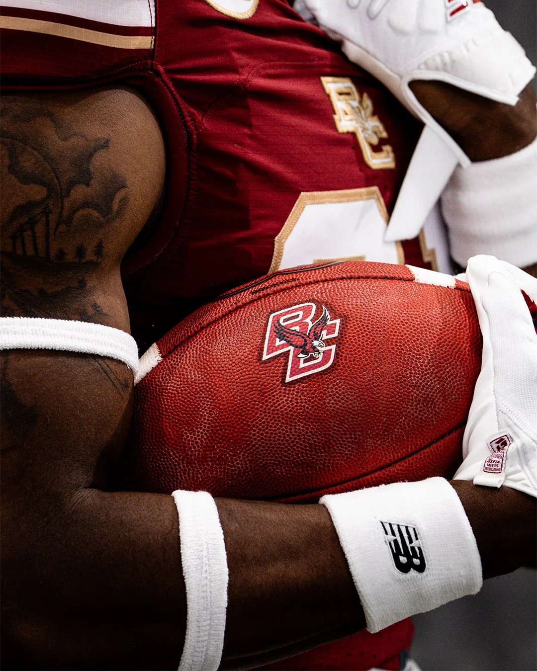 CHESTNUT HILL, MASSACHUSETTS – JULY 9: A close-up detail of a Boston College football player holding a football highlights the team’s branding and uniform during Media Day at Alumni Stadium on July 9, 2025 in Chestnut Hill, Massachusetts. (Photo by M