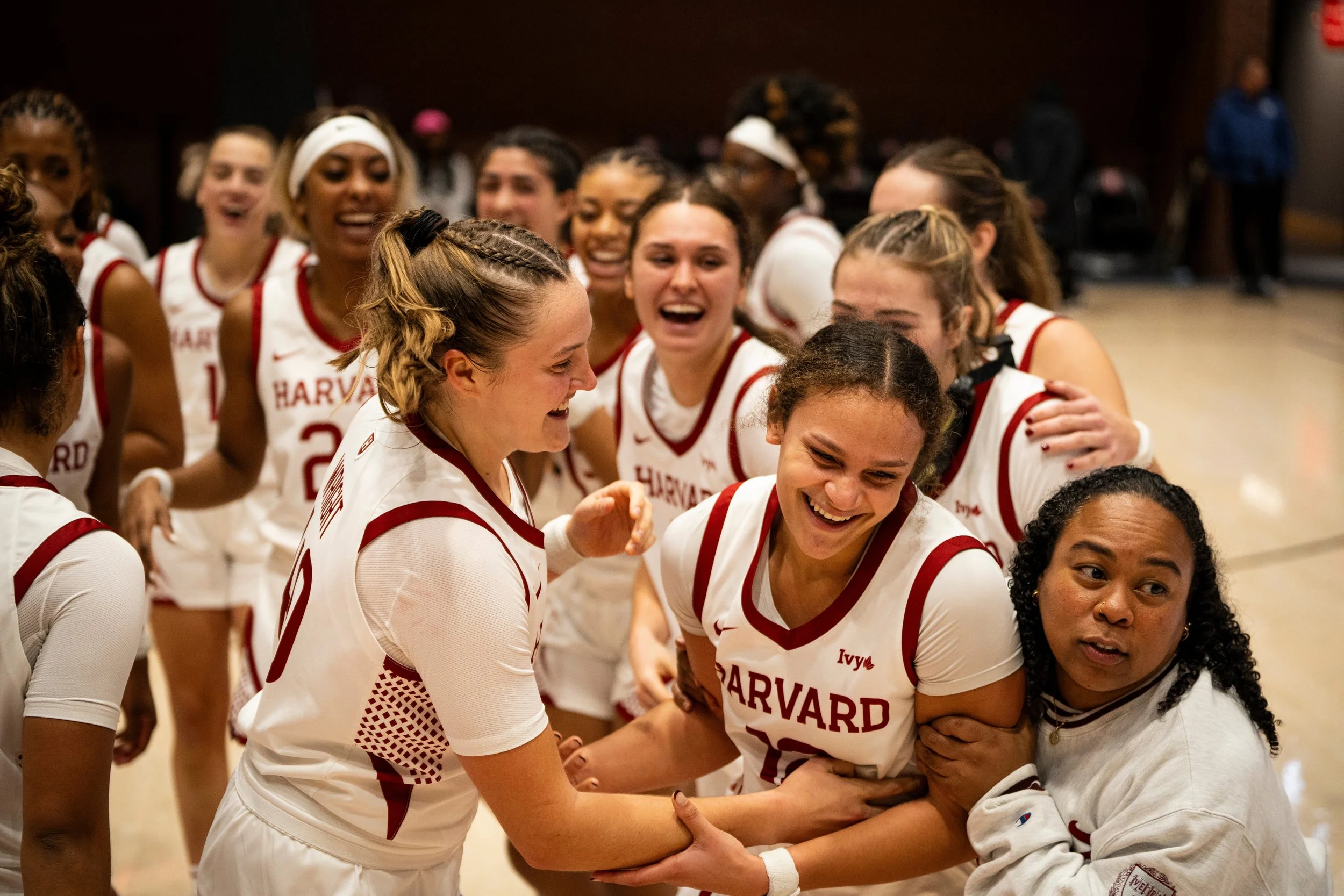 CAMBRIDGE, MASSACHUSETTS - NOVEMBER 7: Harvard Women’s Basketball celebrates Karlee White #12 after an impressive performance during their home opener win against St. John’s at Lavietes Pavilion on November 7, 2025 in Cambridge, Massachusetts. (Photo