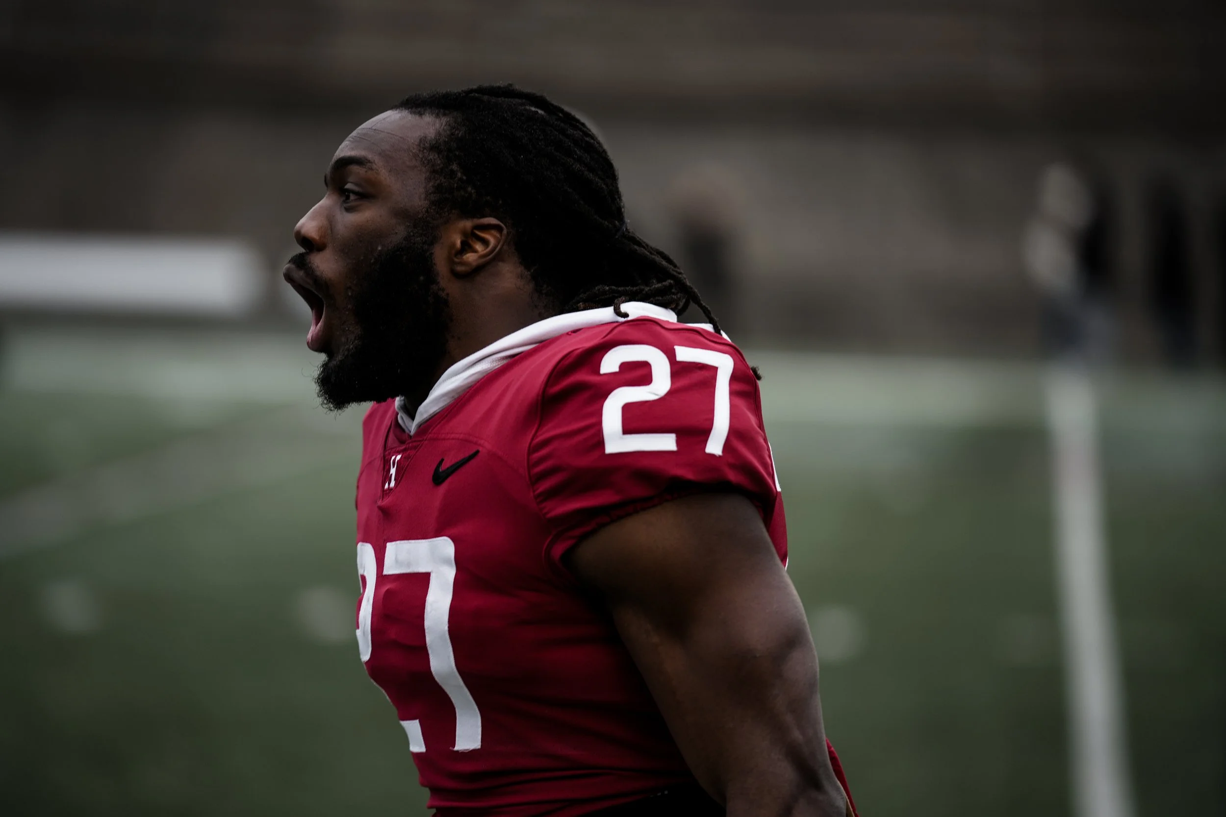 CAMBRIDGE, MASSACHUSETTS - APRIL 5: Isaiah Bullock #27 of Harvard Football shouts in celebration during the team’s Spring Game at Harvard Stadium on April 5, 2025 in Cambridge, Massachusetts. (Photo by Max Elliot/Harvard Athletics)