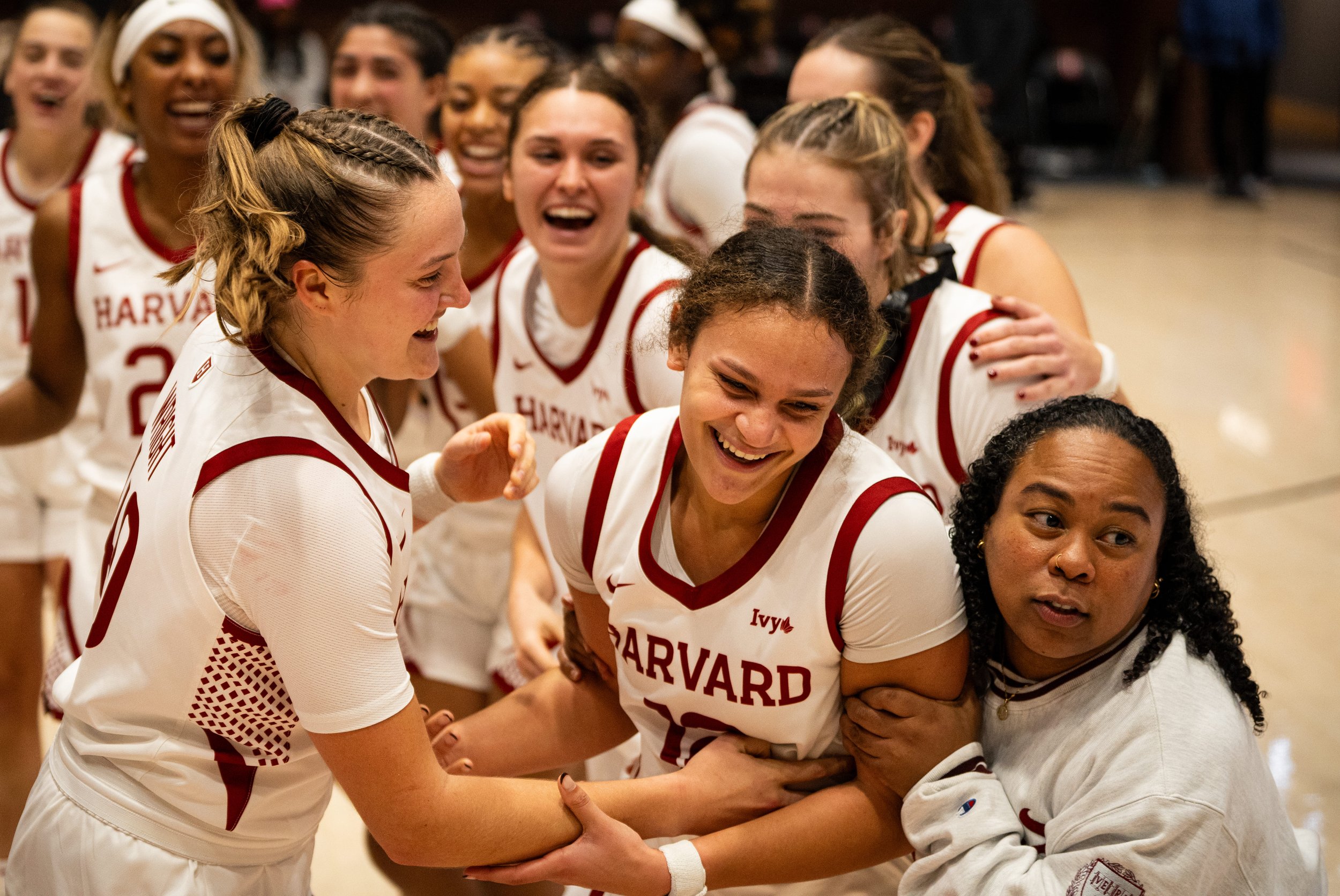 CAMBRIDGE, MASSACHUSETTS - NOVEMBER 7: Harvard Women’s Basketball celebrates Karlee White #12 after an impressive performance during their home opener win against St. John’s at Lavietes Pavilion on November 7, 2025 in Cambridge, Massachusetts. (Photo