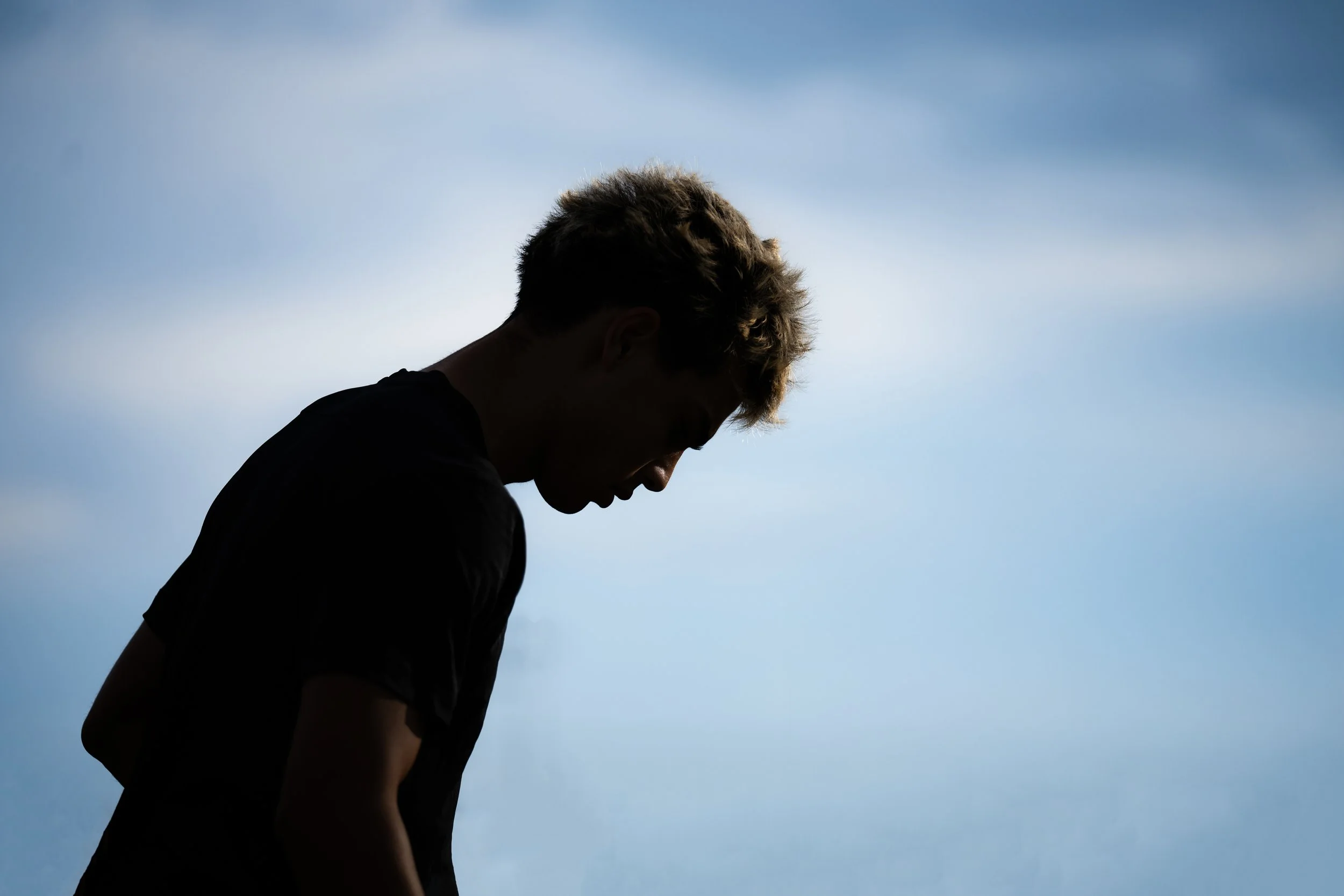 CAMBRIDGE, MASSACHUSETTS - SEPTEMBER 10: Mikey Cortellessa #12 of Harvard Men’s Soccer is silhouetted during pregame warmups before the team’s matchup against Cal at Jordan Field on September 10, 2025 in Cambridge, Massachusetts. (Photo by Max Elliot