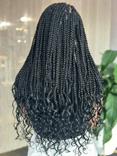 Back view of a woman adorning beautiful braids.jpg