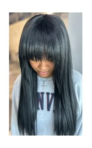 Front View of a woman having a Weaveon Hair.jpg