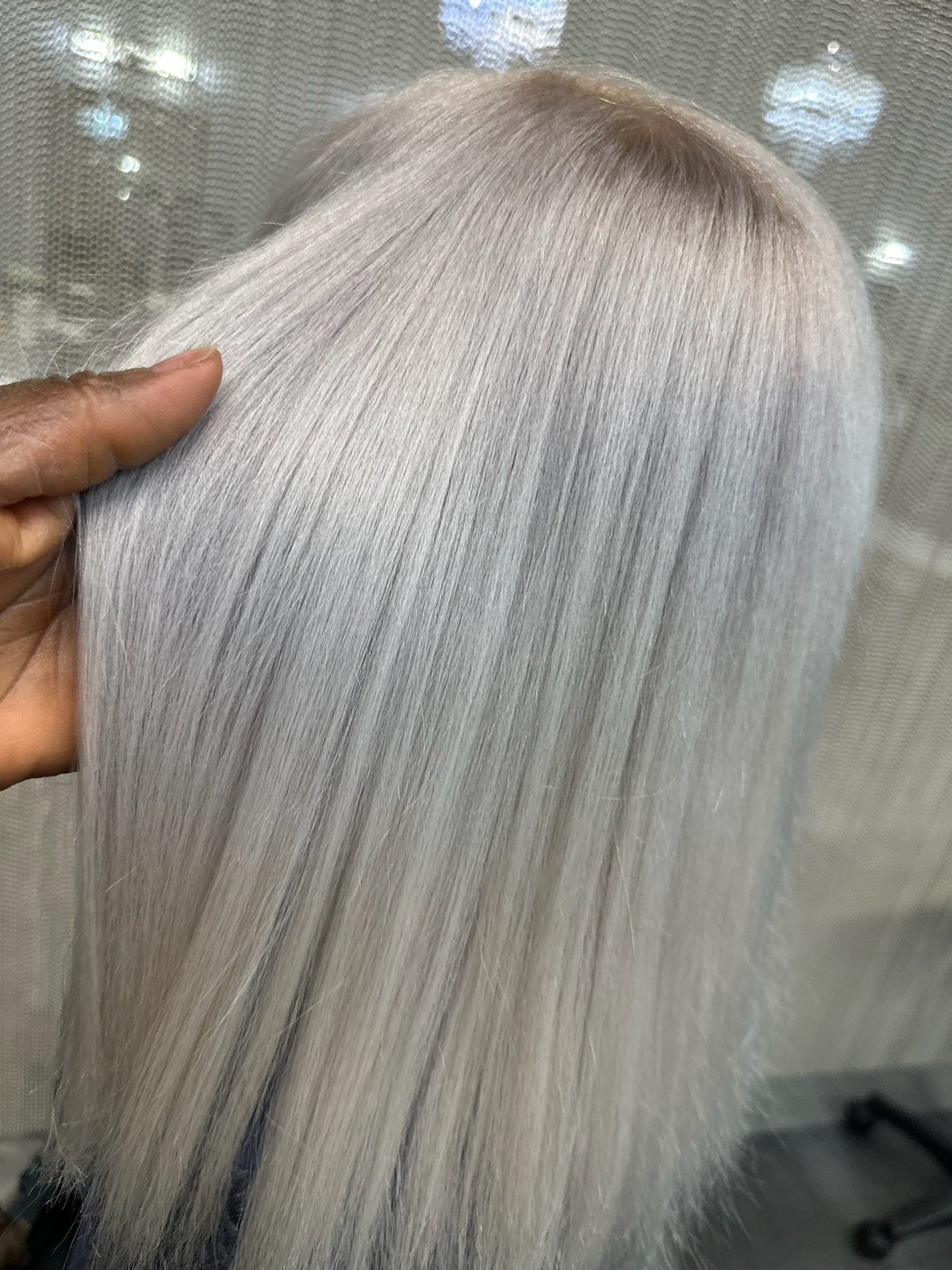 Back view of a woman with a silky feel of her weavon.jpg