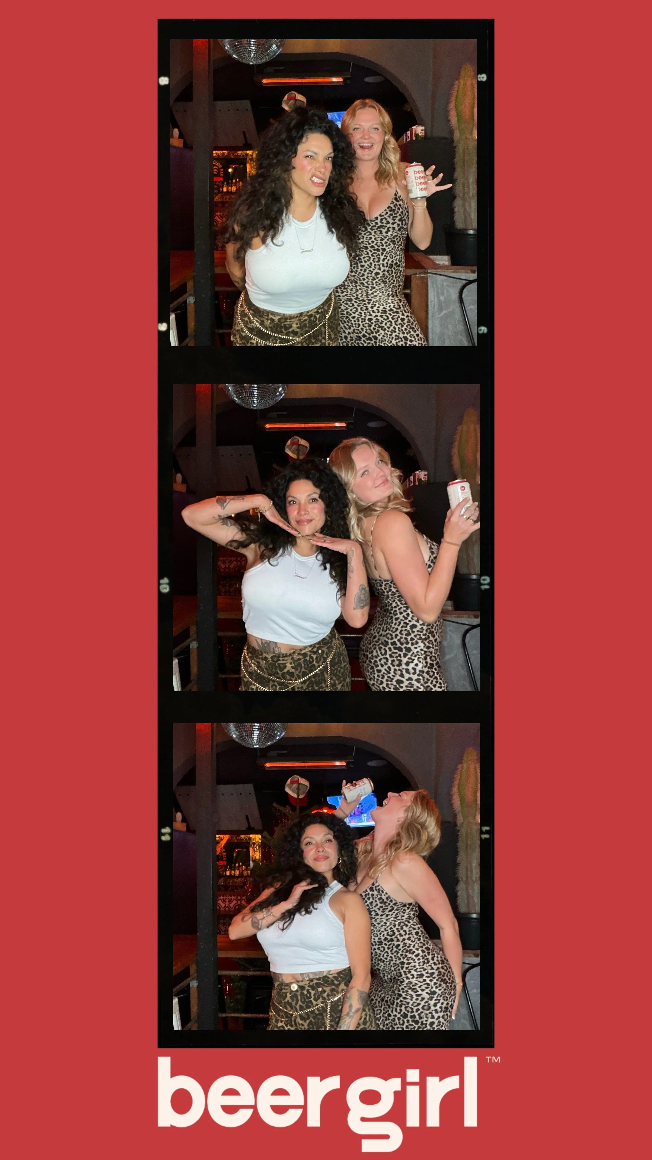 Two women posing playfully at a bar, wearing leopard print outfits. They're holding a drink and making fun gestures in a photo booth style series. Red background with "beergirl" written at the bottom.