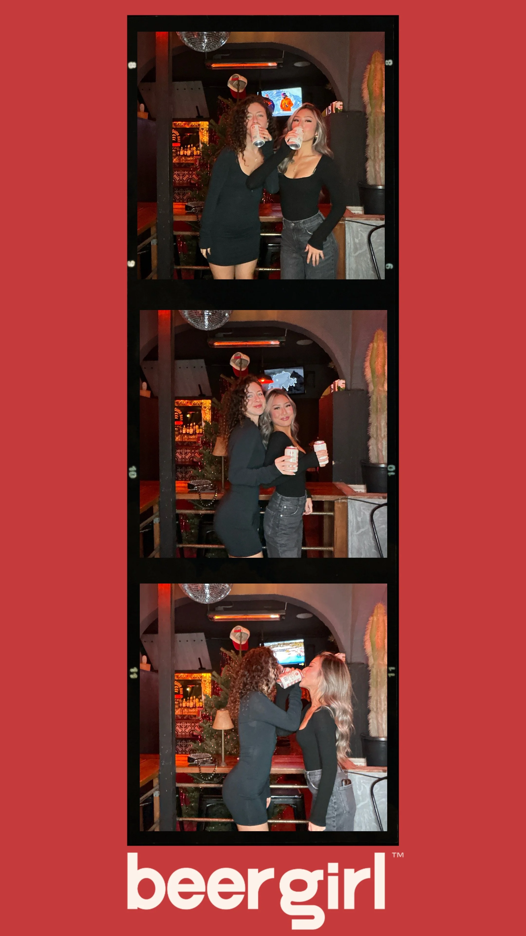 Two women in a bar drinking beer, laughing and posing. Background shows bar decor and a TV screen. The word 'beergirl' appears at the bottom of the image.