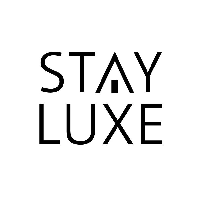 Text image with the words "STAY LUXE" in black capital letters on a white background.