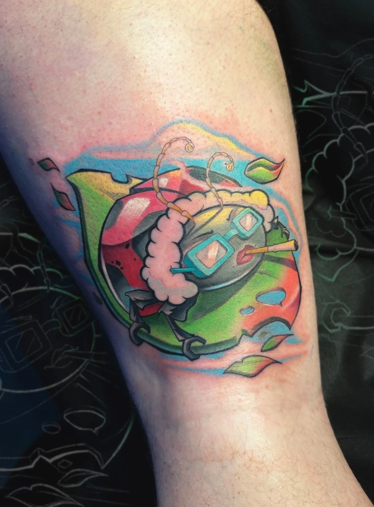 Muriel from Courage the cowardly dog turned into a ladybug. Color cartoon style tattoo on the leg.