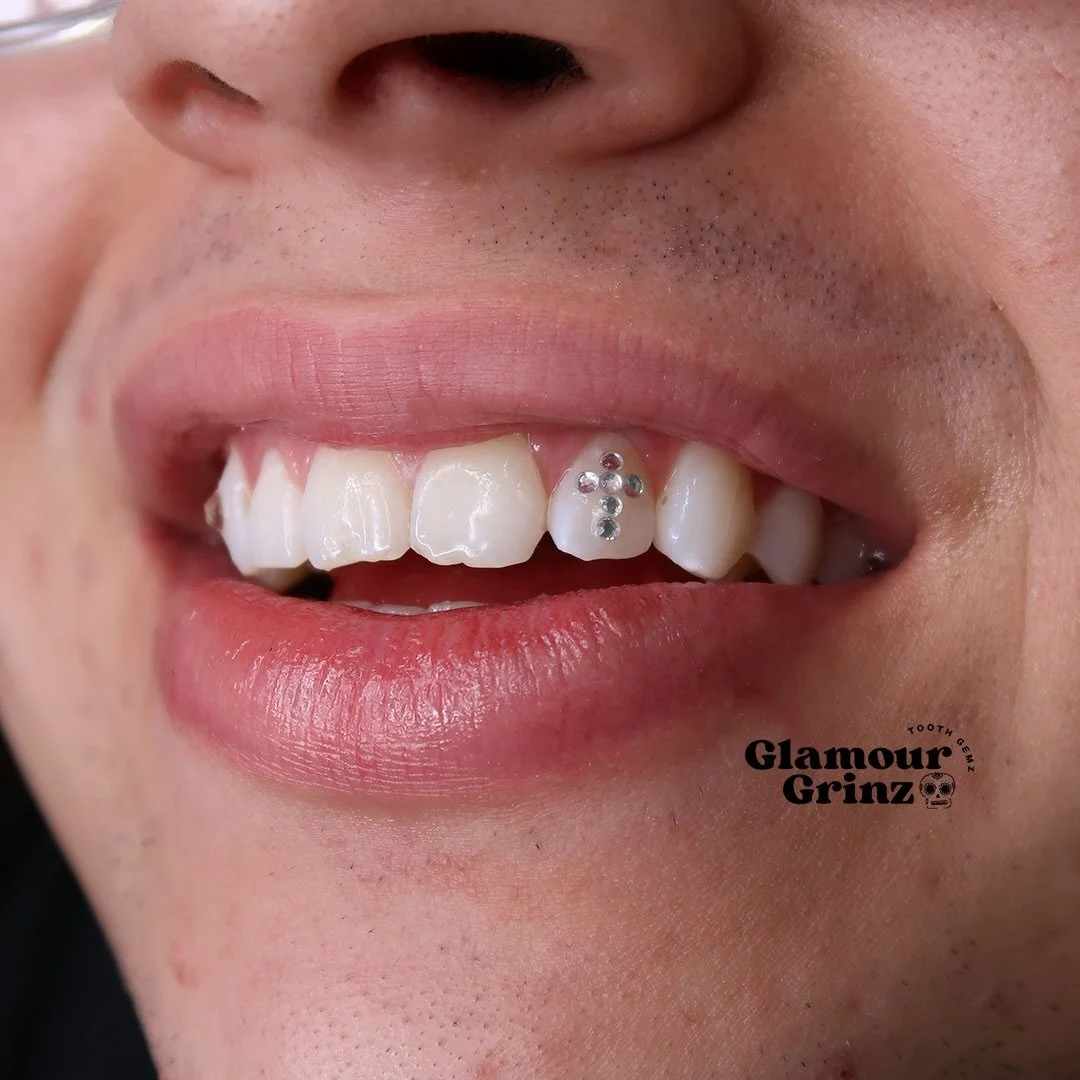 Cross design is too clean🥶💎✨
What do you think? 👇🏼

Click &ldquo;book now" in bio

📍Green Bay, WI
📲 (920) 412-4965

.

#glamourgrinz #toothgems #teethjewelry #shinyteeth greenbaywi