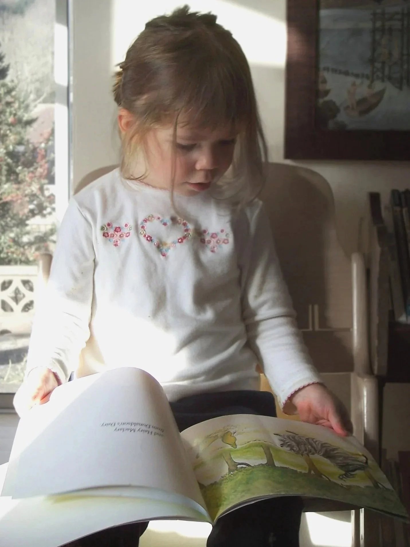 Small child reading alone