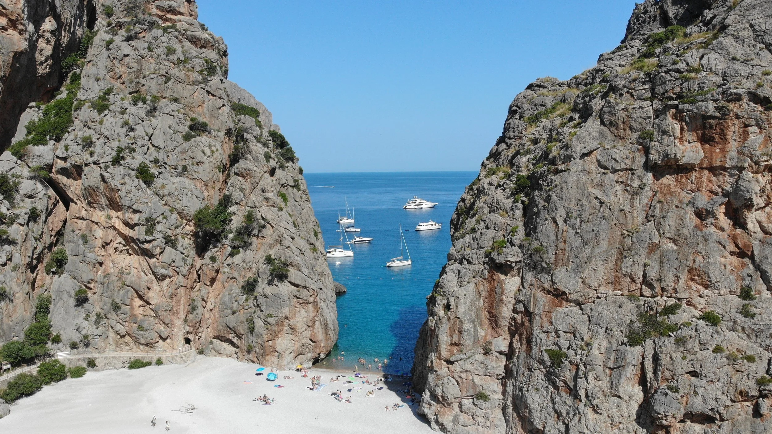 Scenic rocky cove and turquoise waters during a Held Retreats wellness retreat.