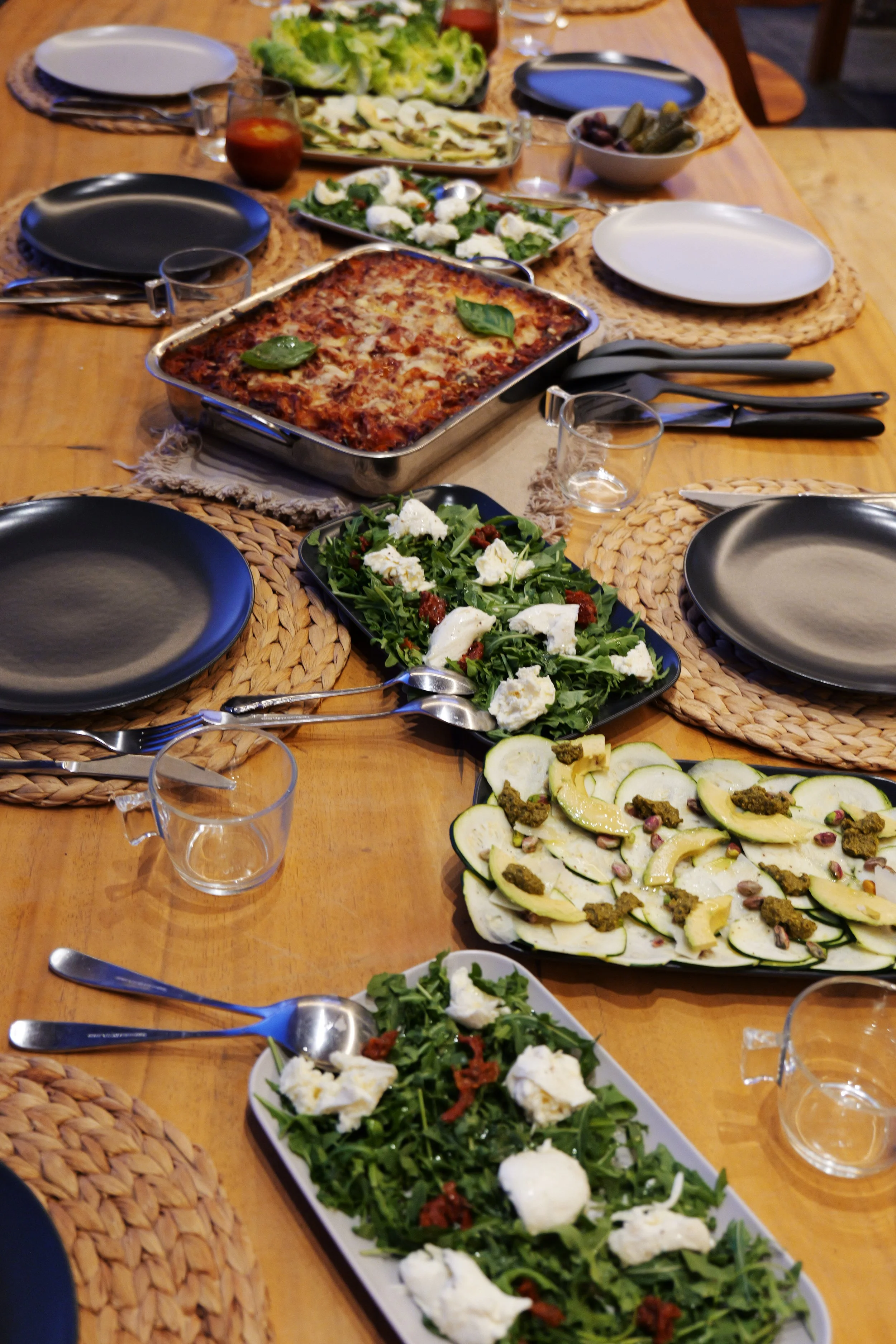 Mediterranean meals served on a wooden table during a Held Retreats wellness retreat