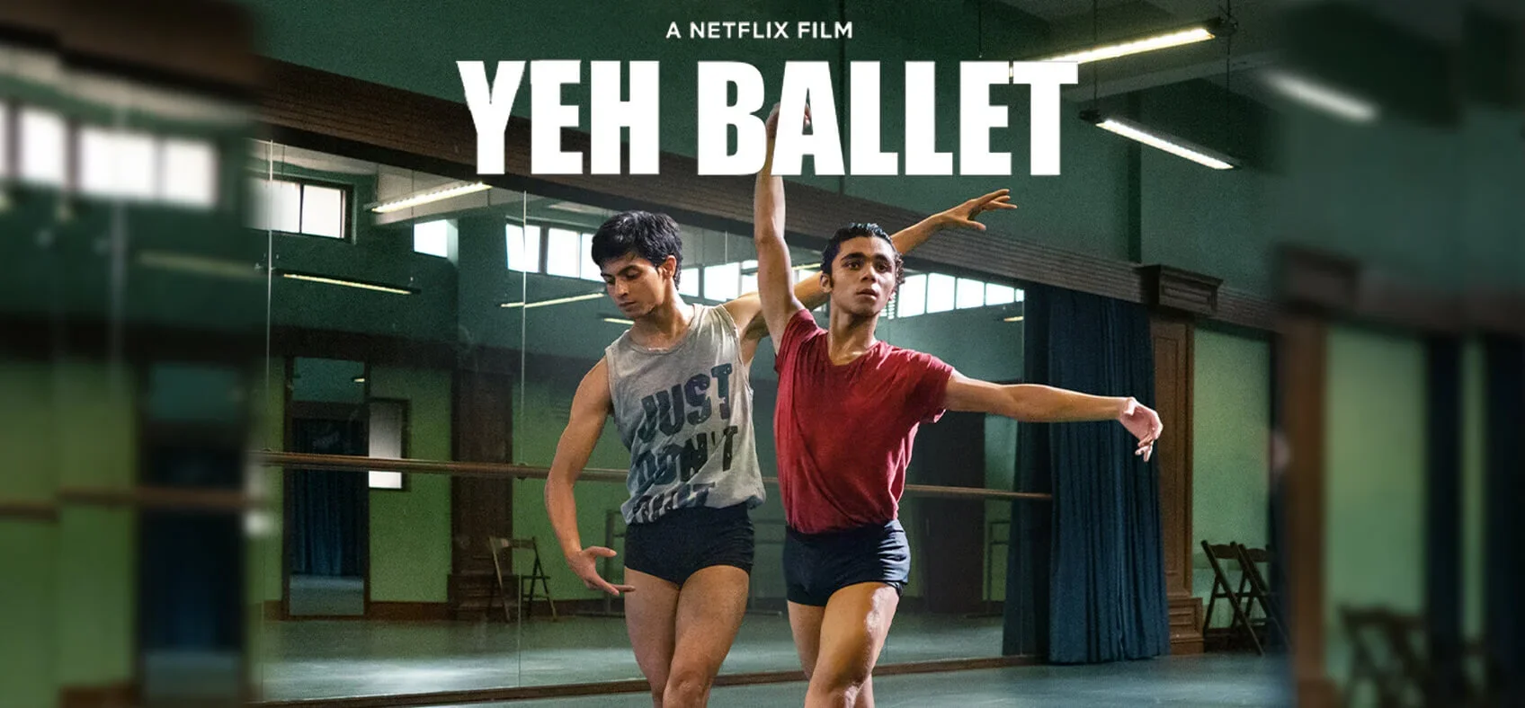 Two ballet dancers practicing in a studio, one wearing a gray tank top and black shorts, the other in a red T-shirt and black shorts, with the title 'Yeh Ballet' in large white letters above them.