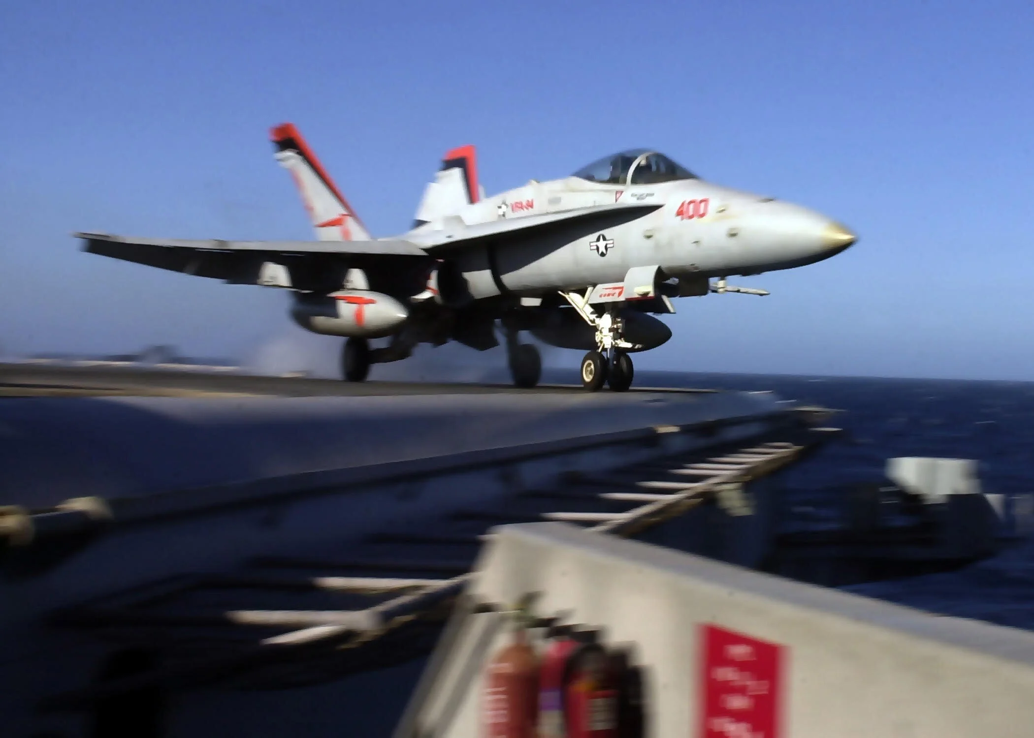 A US Navy jet taking off an aircraft carrier