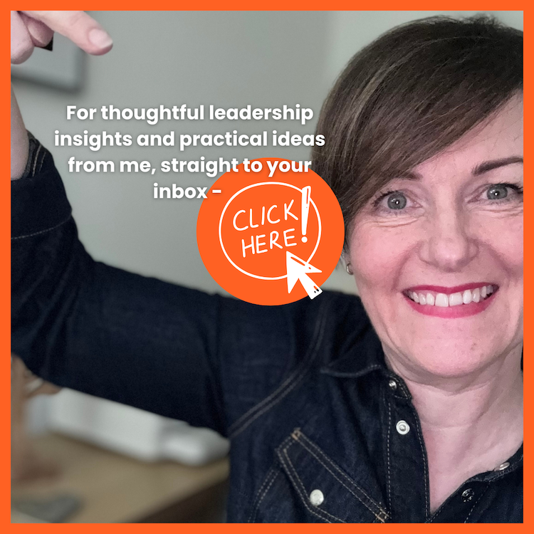 Picture of Sharon Smith of Own Your LEadership wearing a denim shirt and pointing at a sign for people to click to receive insights and ideas to their inbox.