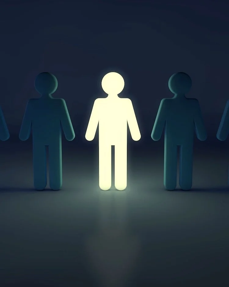 outline image of a person standing out against a black background with outlines of other people. Someone is feeling like they are winging it.