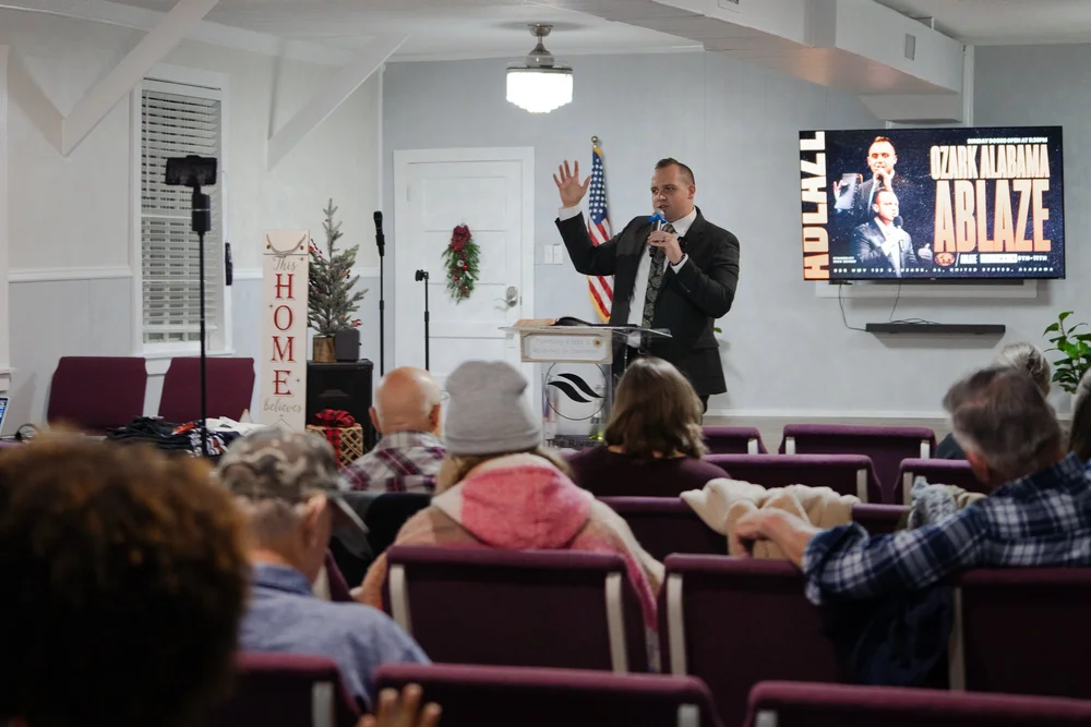 Congregation worshipping during a revival service