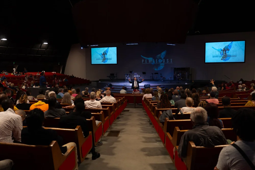 Woman worshipping with hands raised