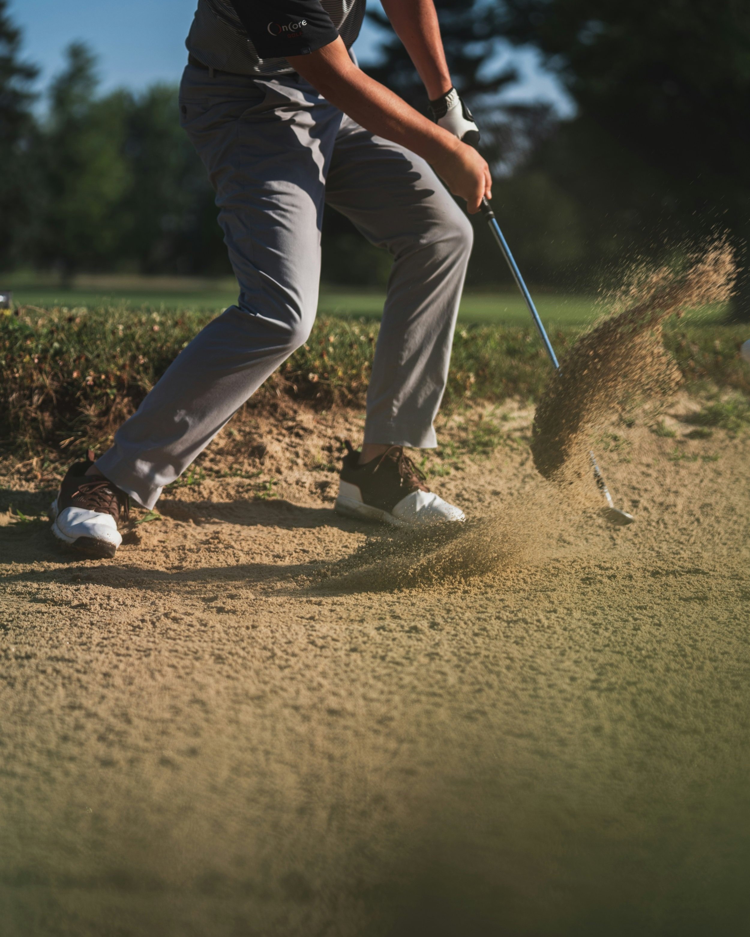 Person+holding+golf+club.jpg