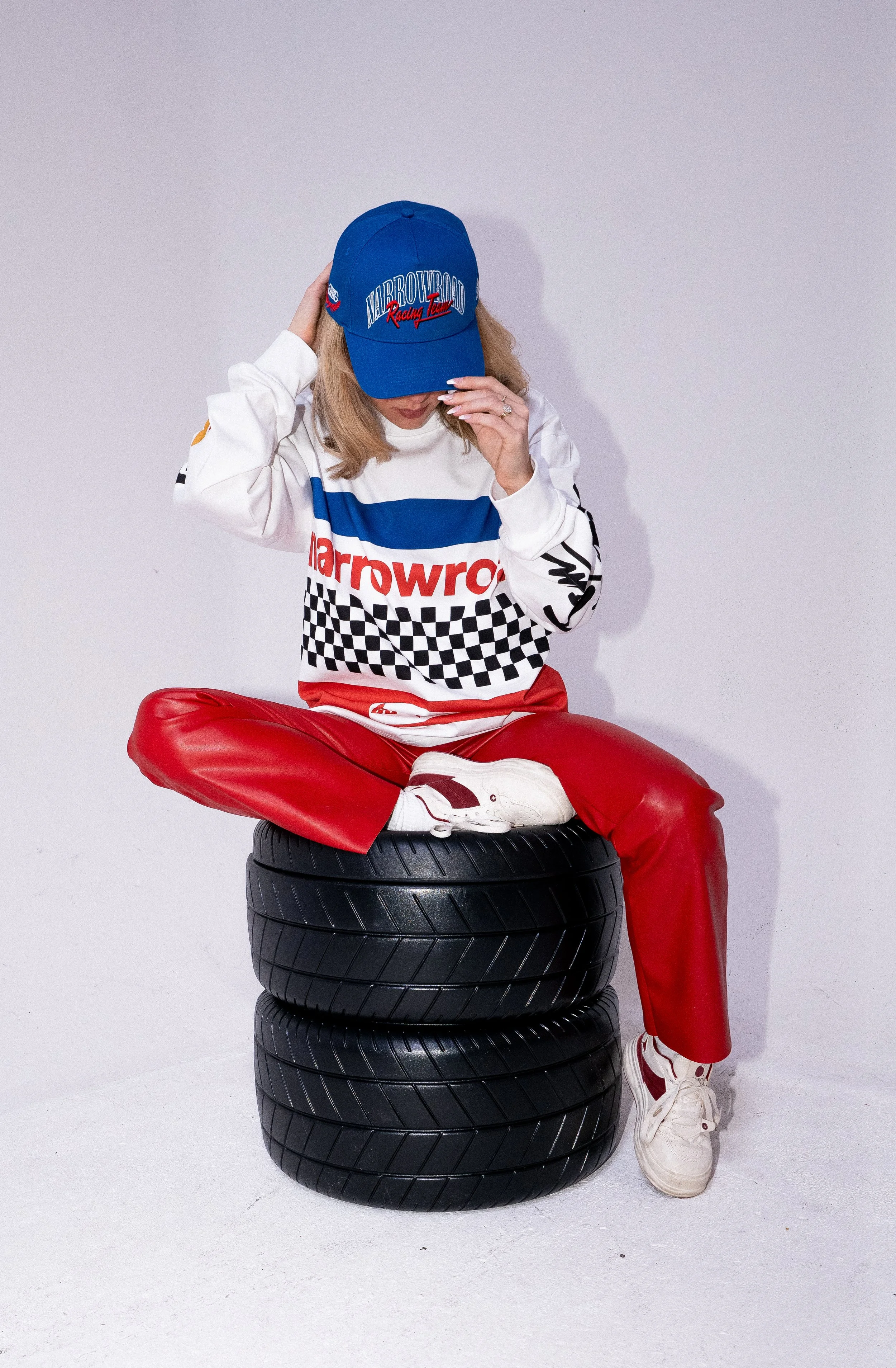 Christian clothing brand Be Good Bi'Gud streetwear for men and women race car themed white long sleeve graphic tee and blue hat