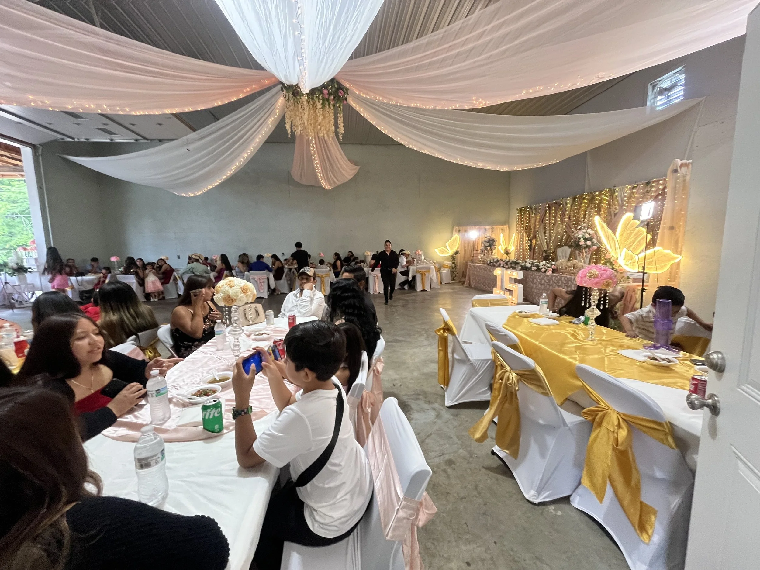 Quinceañera - Light pink theme with drapes and lots of decoration