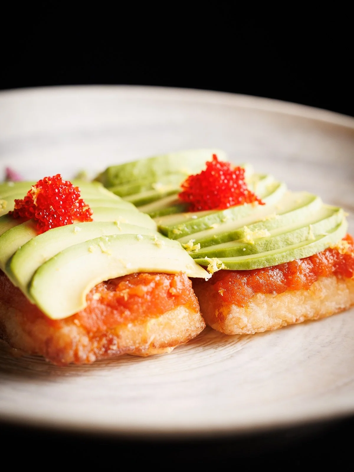 Meet our Spicy Tuna Crispy Rice: a masterclass in texture and flavor. We start with a foundation of golden, pan-seared crispy rice, layer on our signature spicy tuna, and finish with buttery avocado, bright citrus zest, and a pop of red tobiko.
It&rs