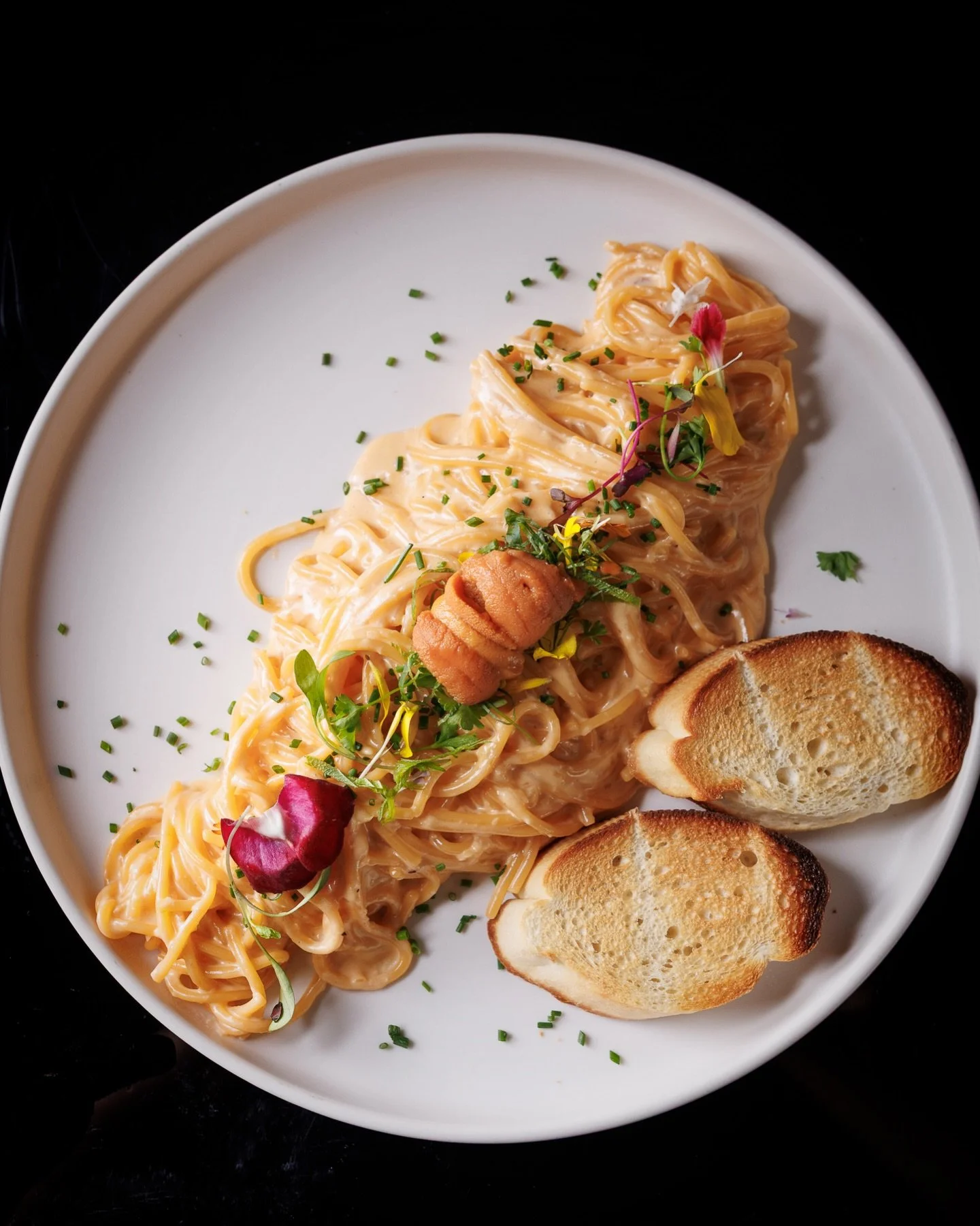 Creamy, dreamy, uni everything 🌊✨ our Uni Cream Pasta hits different &mdash; silky sauce, fresh sea urchin, toasted bread on the side. Under the Moon, Every Bite Delights.

📍LA: 3959 Wilshire Bl. #A-11, LA, CA 
(213) 375-7500
📍OC: 16492 Beach Blvd