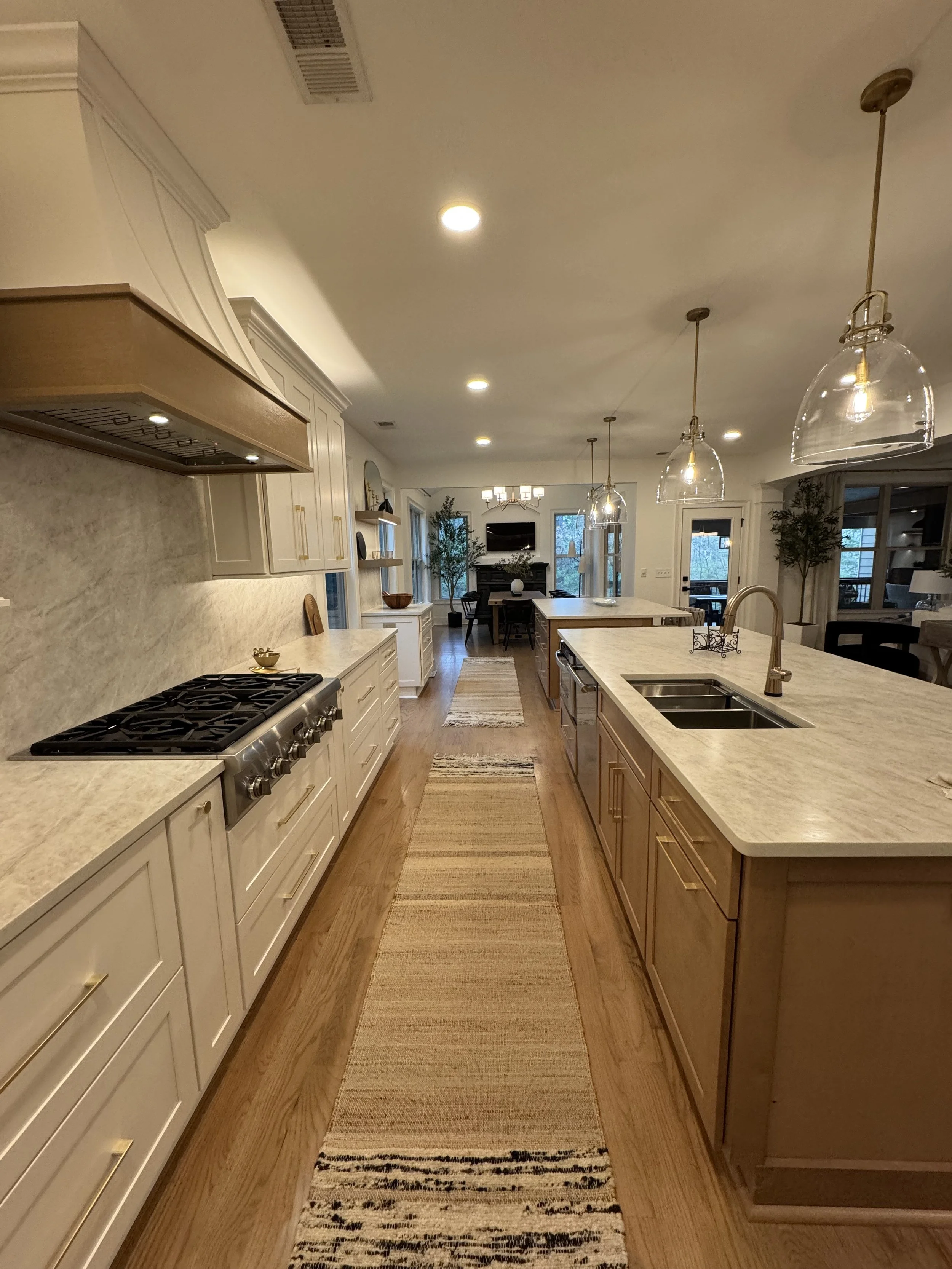 North Atlanta kitchen remodel with new appliances, silver accents, and quartz countertops.