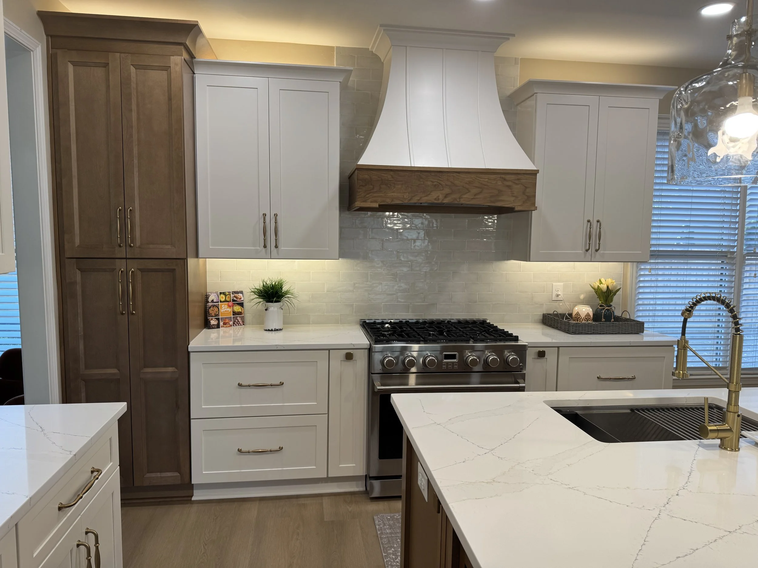 Modern Johns Creek, GA kitchen remodel with new range, hood, and cabinets