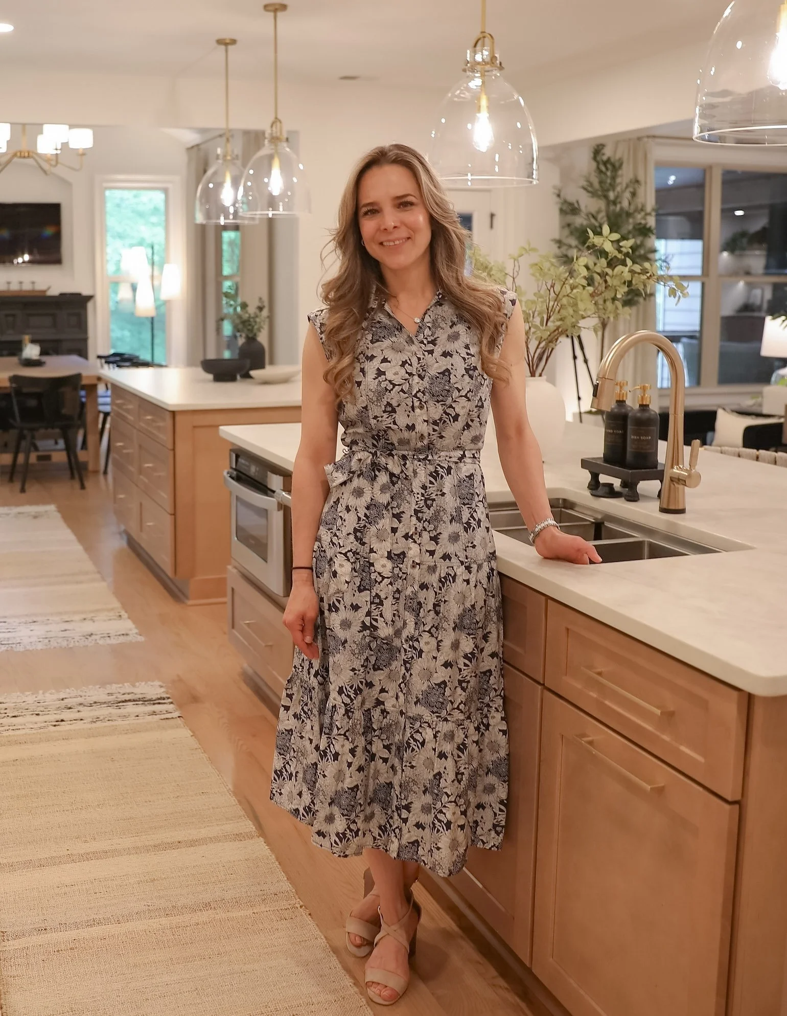 Photo of Karla Caudill, Grand Home Design CEO and Head Designer, in recent Milton, GA kitchen remodel.