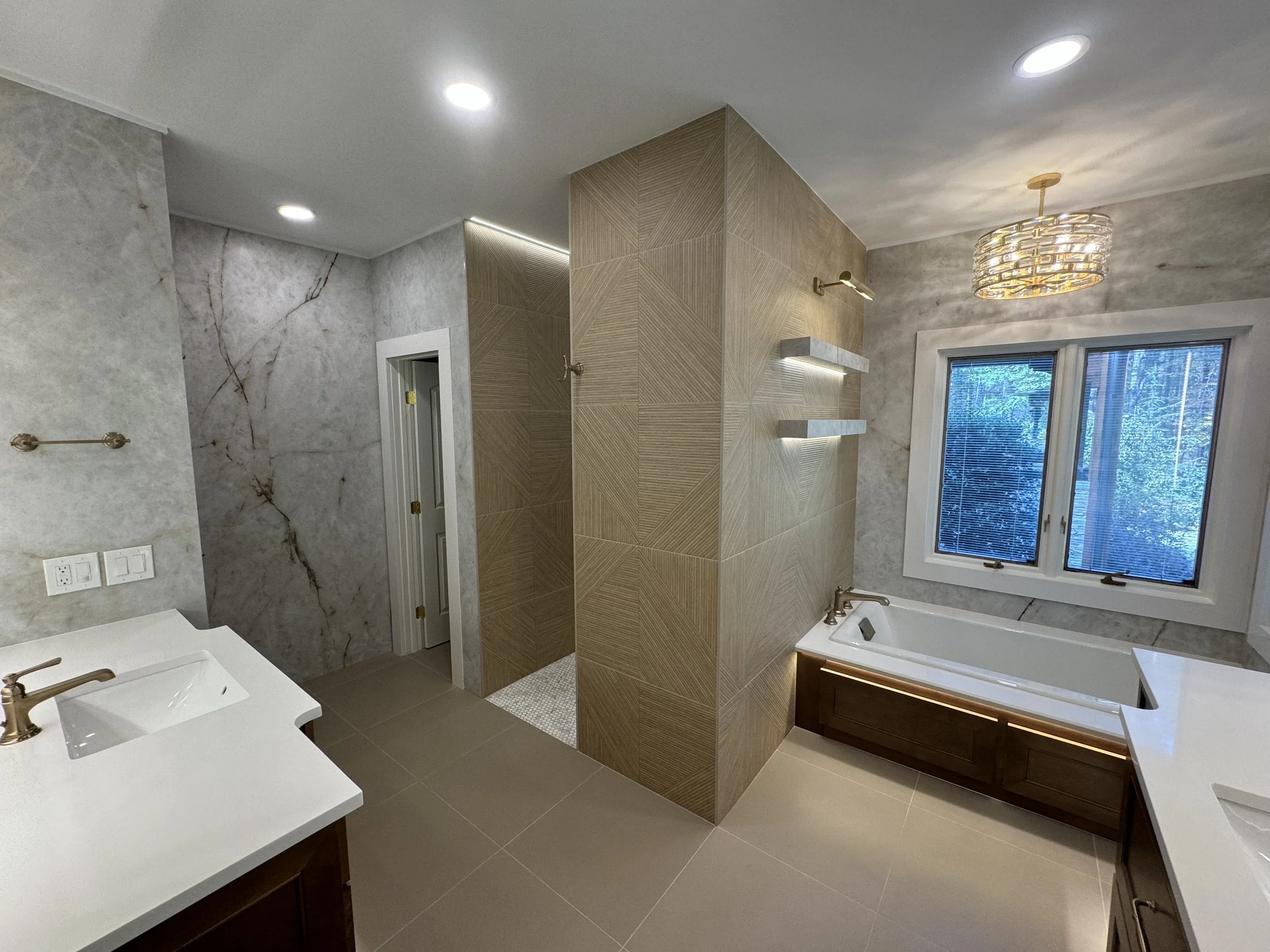 Marietta bathroom remodel with curbless shower, frameless glass, and correct ventilation