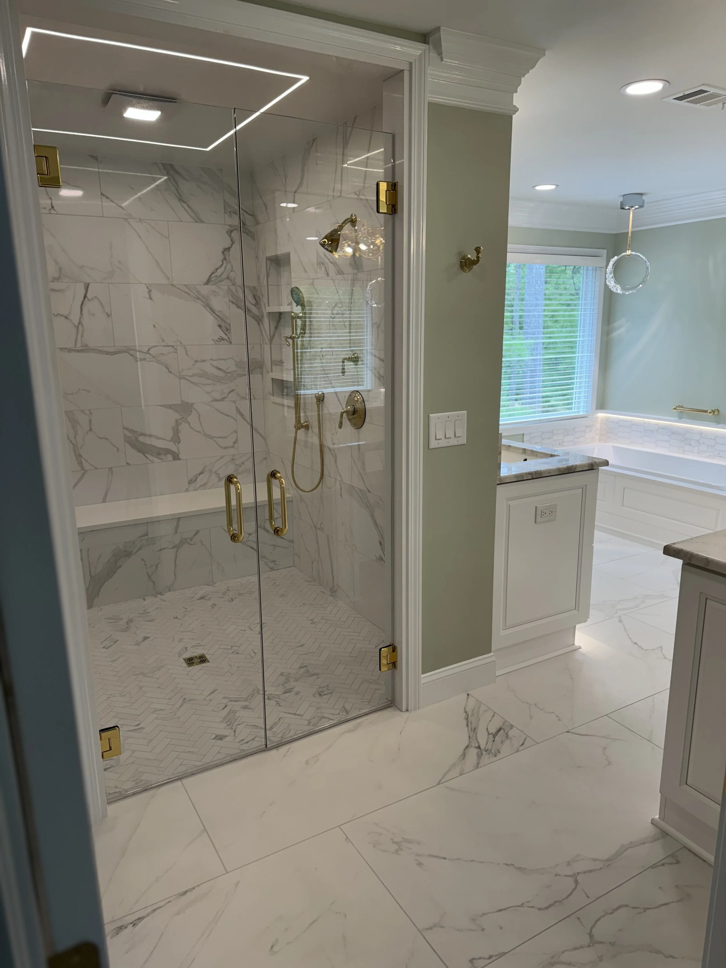 Beautiful Alpharetta bathroom remodel with walk in shower and white marble tile