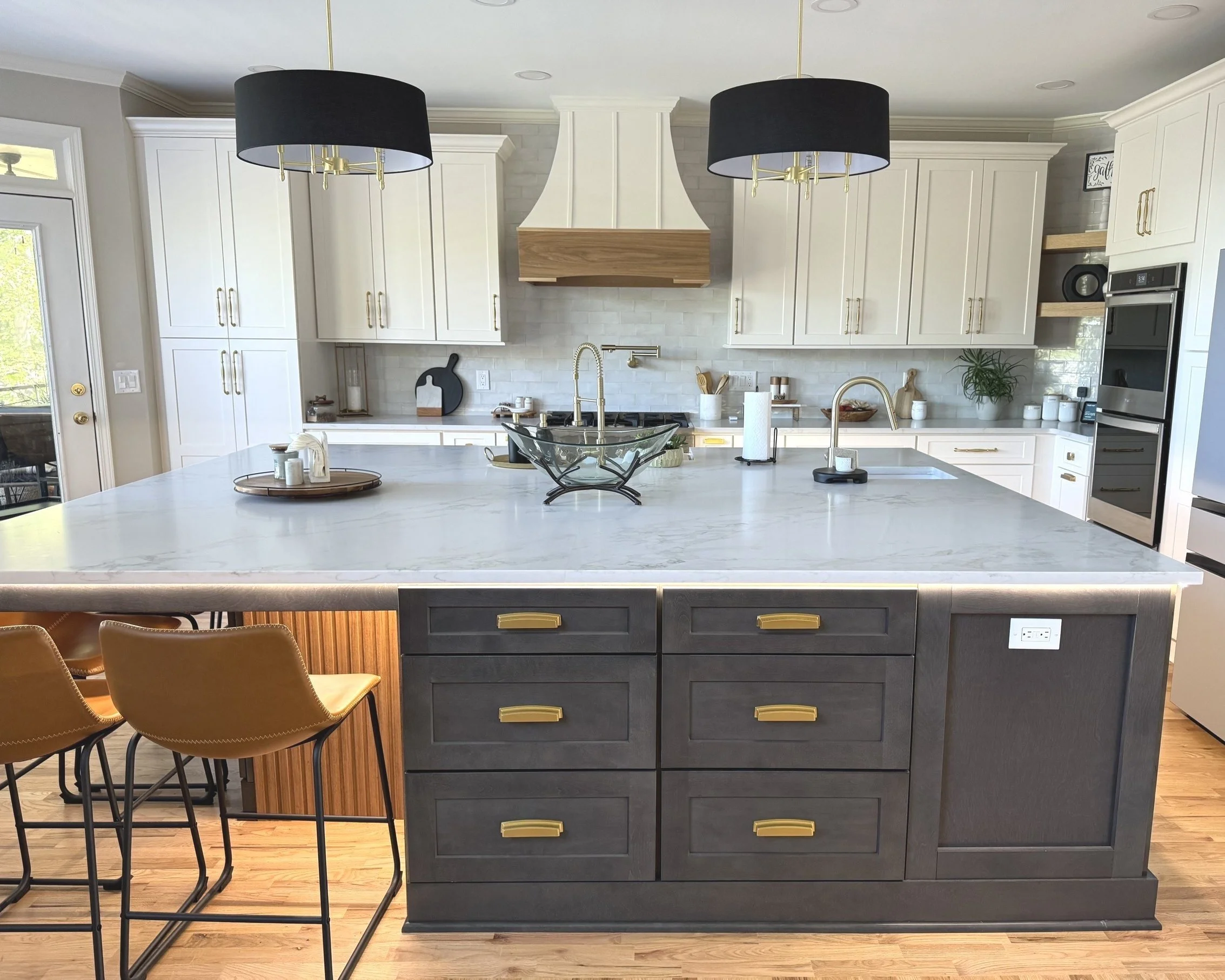Stunning kitchen remodel in Marietta, GA with accent lighting and gold finishes.