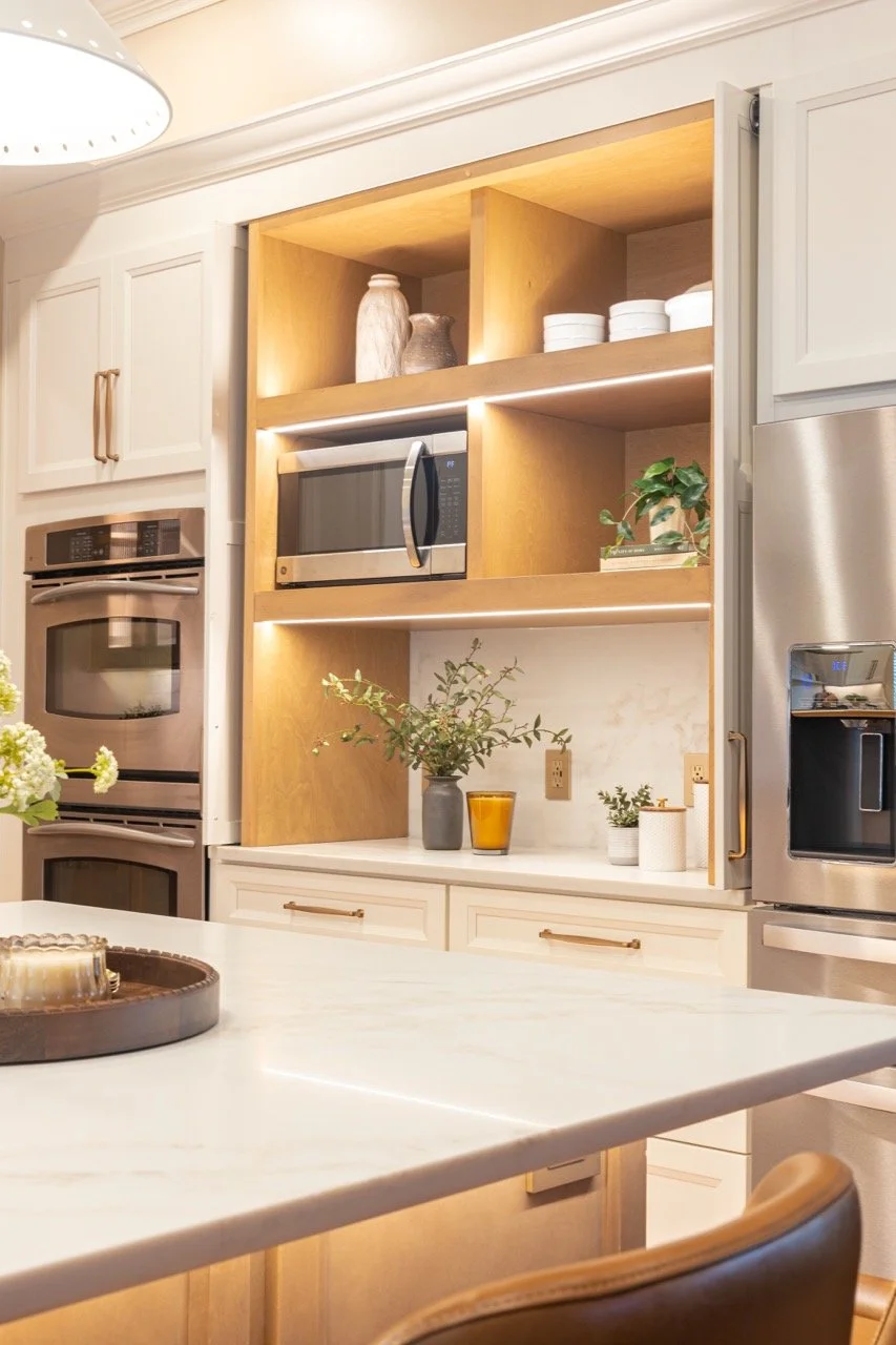 Beautiful kitchen remodel in Atlanta, GA with light quartz counter tops and natural wood shelving