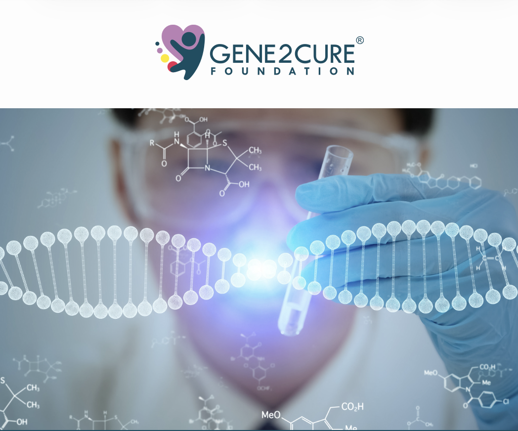 Research scientist wearing gloves and glasses holding a test tube in front of a digital DNA strand and chemical formulas, with the Gene2Cure Foundation logo at the top.