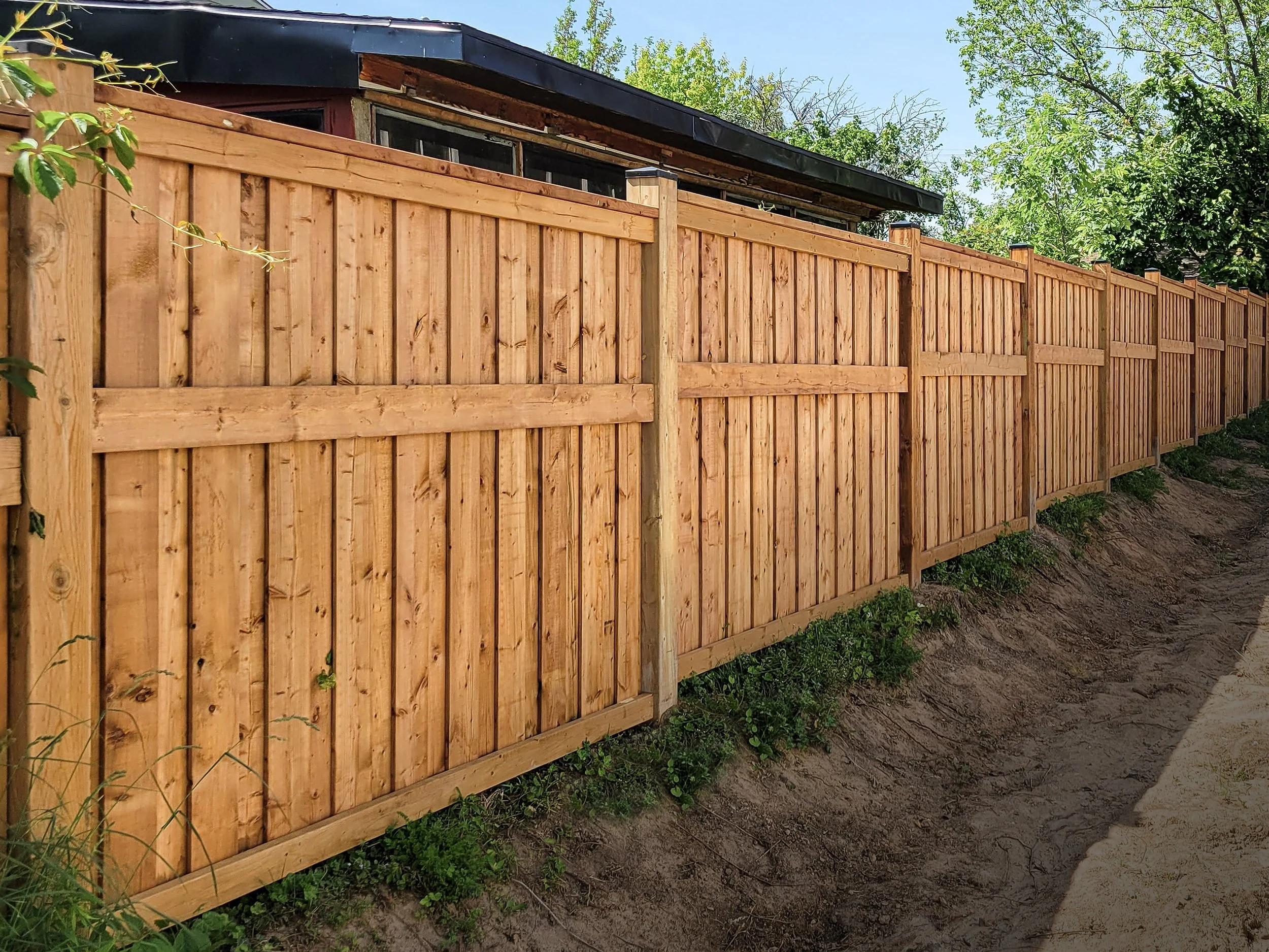 Decorative 6-foot wood privacy fence with framed panels