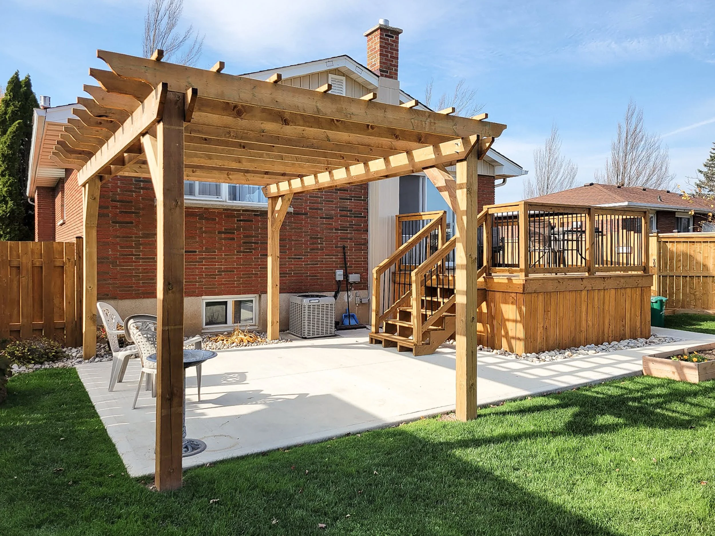 Freestanding backyard pergola with open slat roof