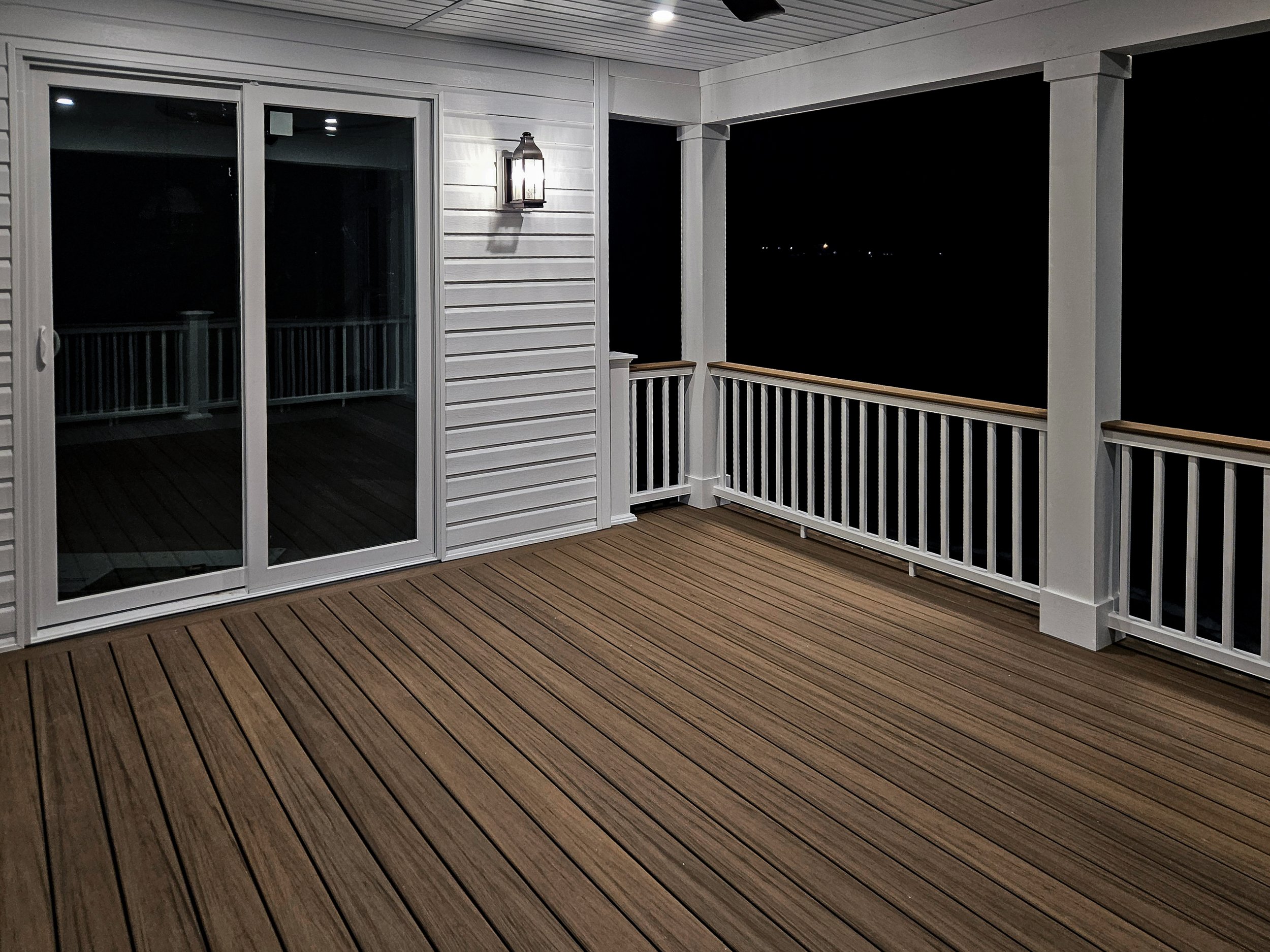 fairport-ny-covered-deck-night-view-timbertech-antique-leather.jpg