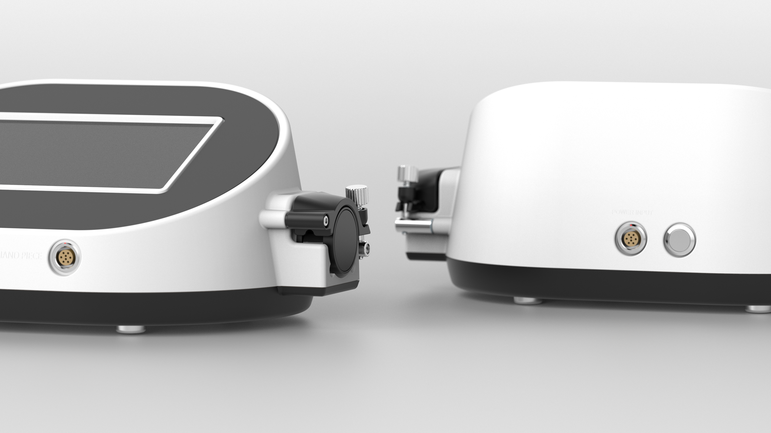 Close-up of two vintage turntables, showing their tonearms and control buttons, on a plain background.