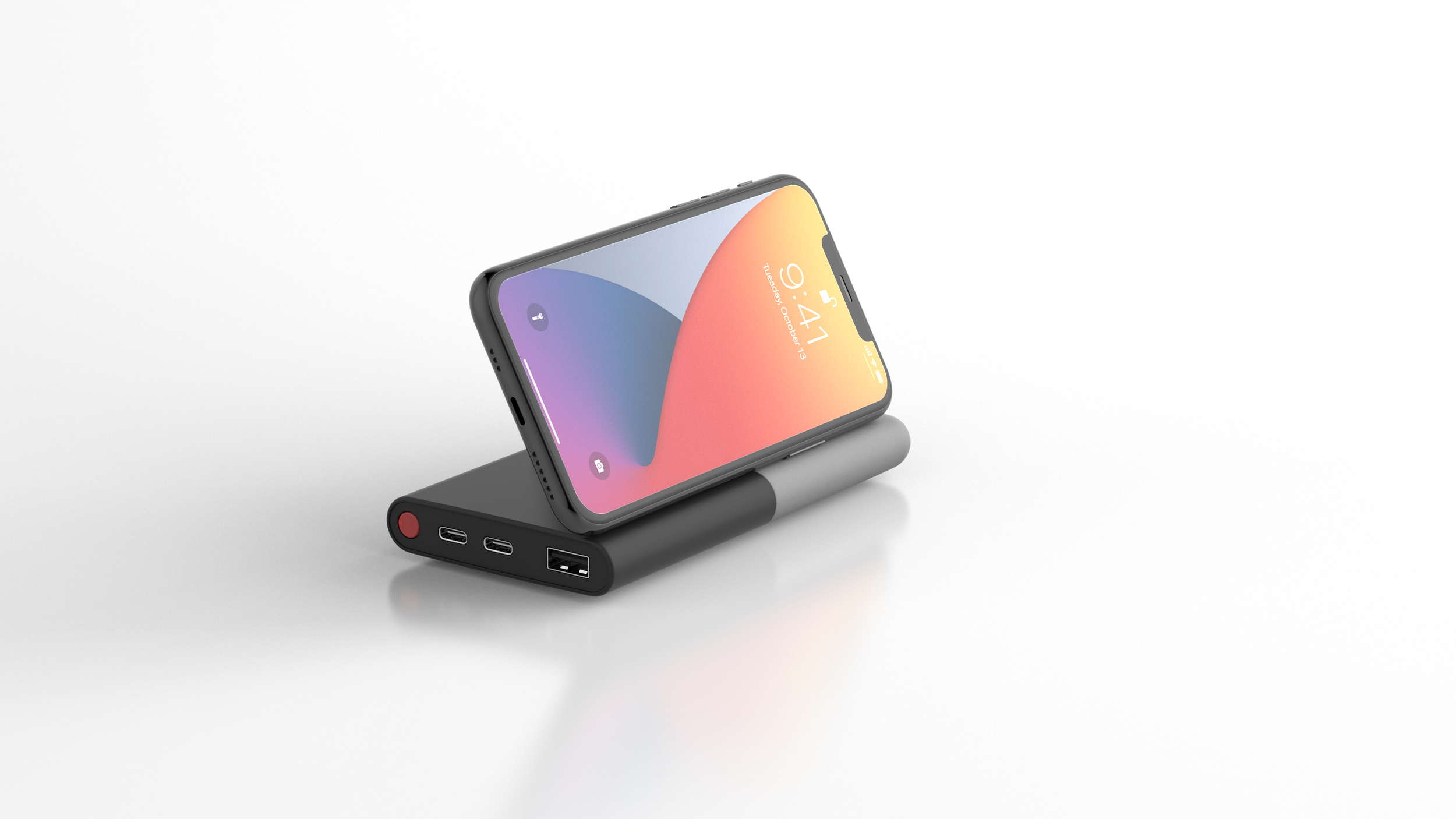 A smartphone placed on a portable charger with multiple ports on a white background.