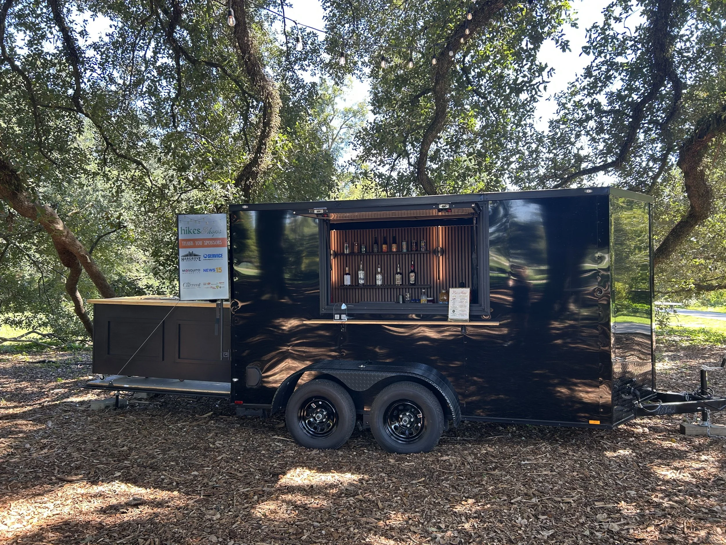bar rouler set up at an outdoor event under oak trees in Lafayette, Louisiana