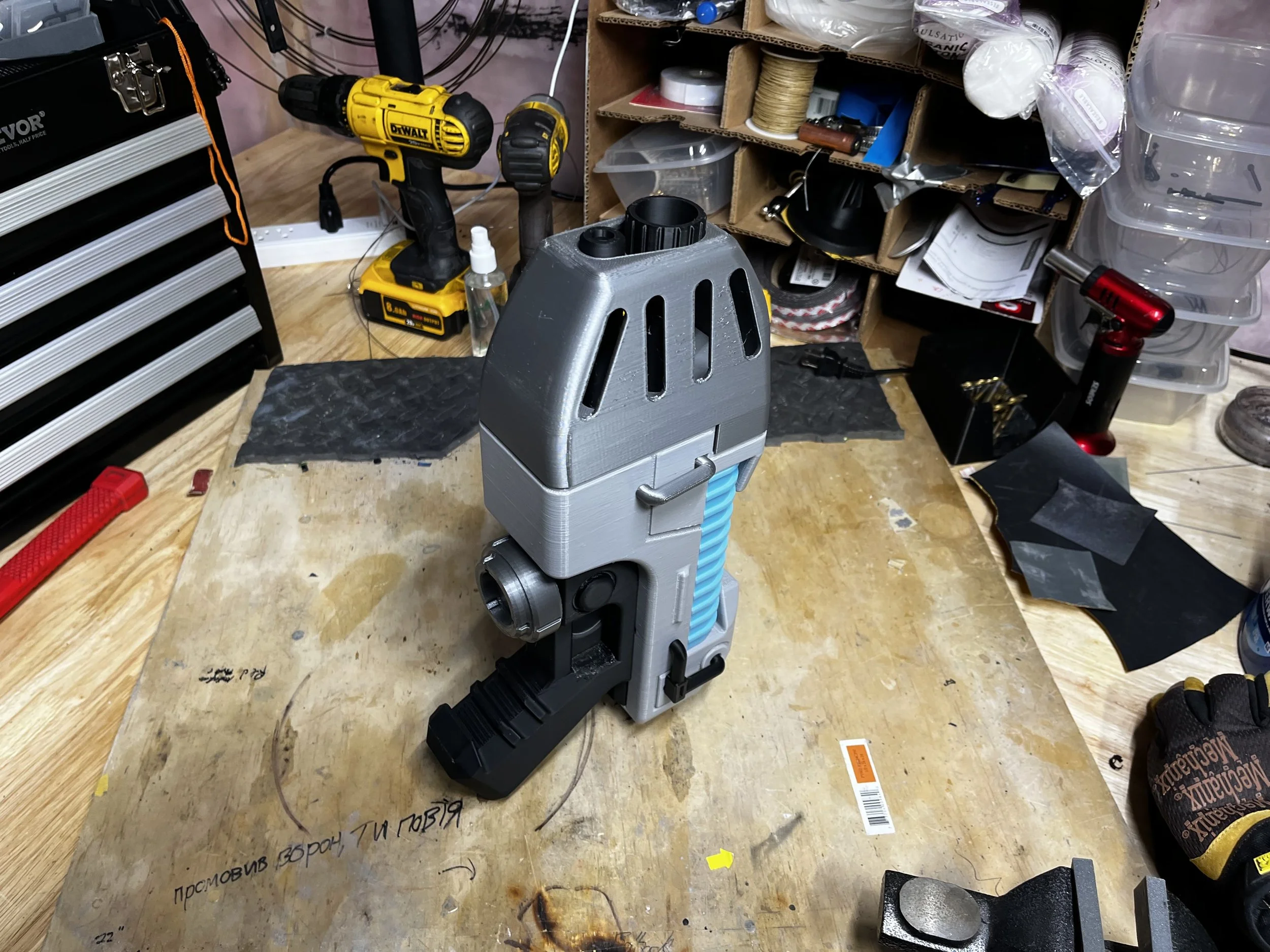 Warhammer styled plasma pistol standing on its butt
